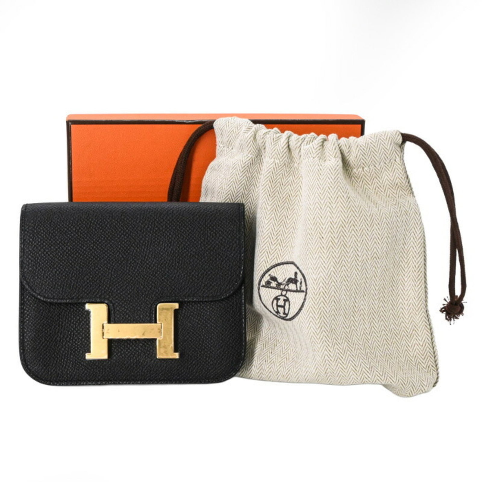 Epsom Leather Bi Fold Hermes Wallet: Epsom Leather Bi Fold Hermes Wallet Epsom Leather Bi Fold Wallet from Hermes features high-quality Epsom leather in black, with precise dimensions of 10cm x 12.5cm x 3cm. This bi-fold wallet is made