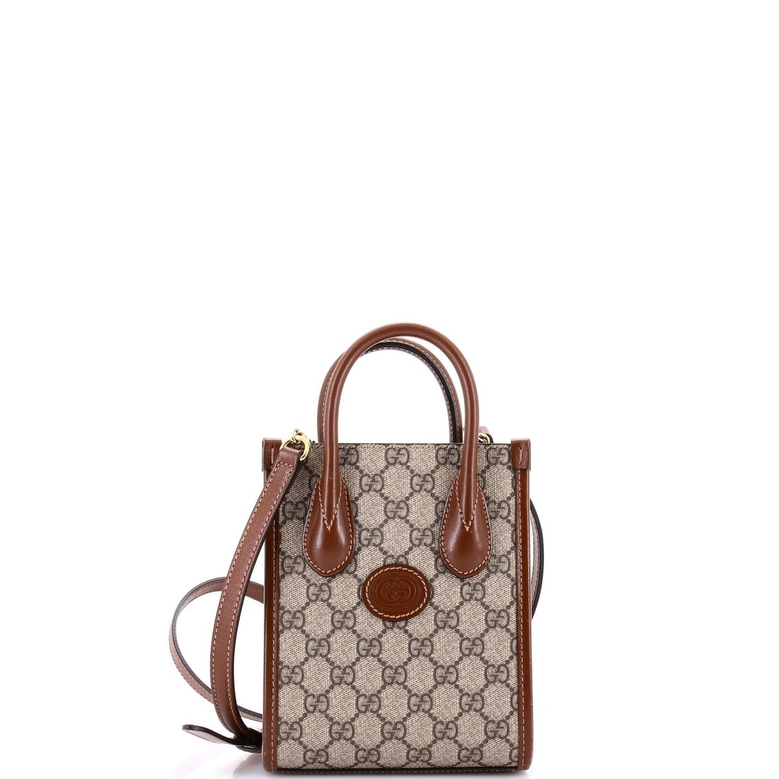 Mini GG Coated Canvas Patch Interlocking Tote Gucci: Mini GG Coated Canvas Patch Interlocking Tote Gucci Mini Gucci Coated Canvas Patch Interlocking Tote with Brown Exterior and Neutral Interior, featuring interlocking G patch design. This mini tote