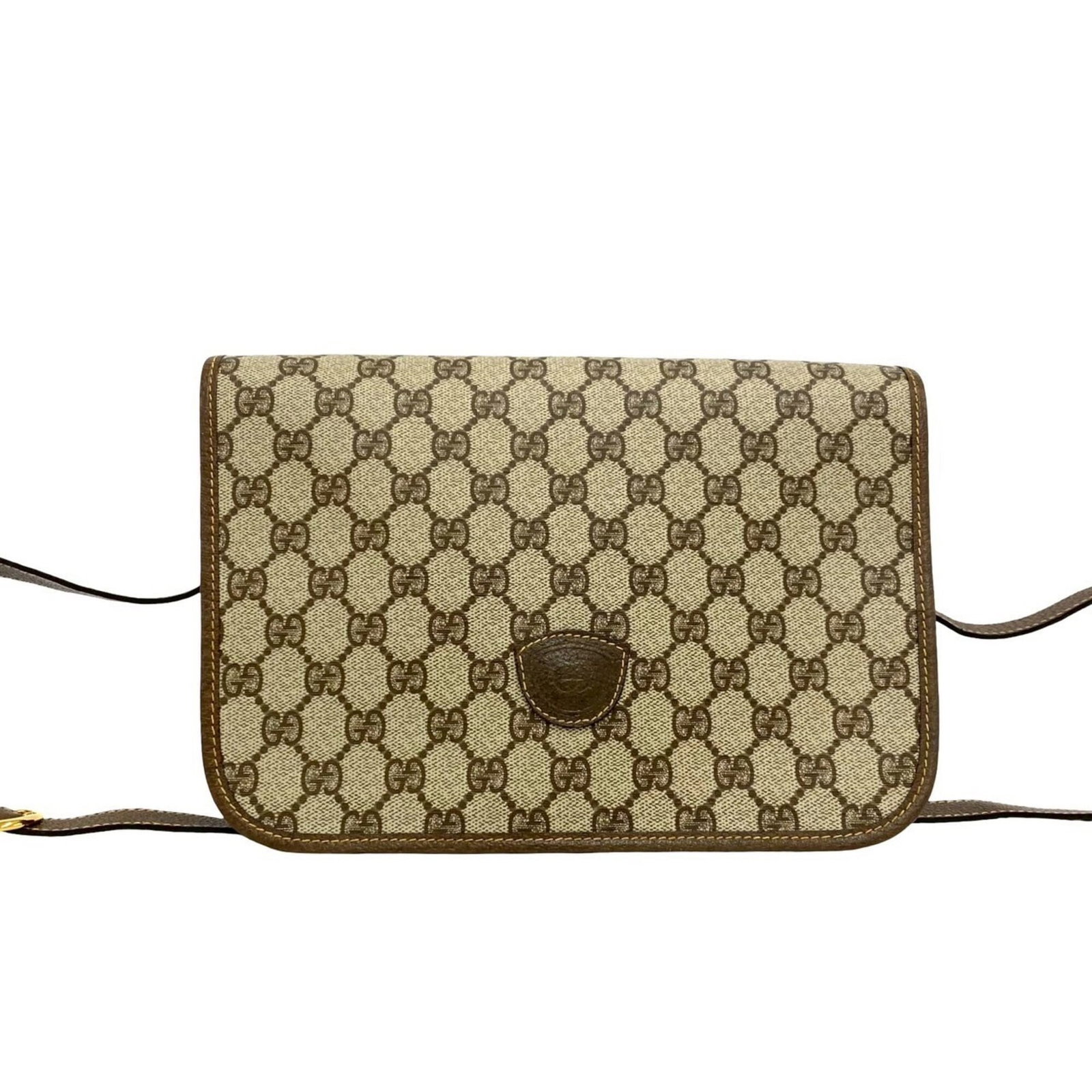 Pvc leather shoulder bag by Gucci: Pvc leather shoulder bag by Gucci Pvc leather shoulder bag by Gucci in brown, featuring a classic pochette design with subtle scratches and signs of usage. The bag measures approximately 18cm x