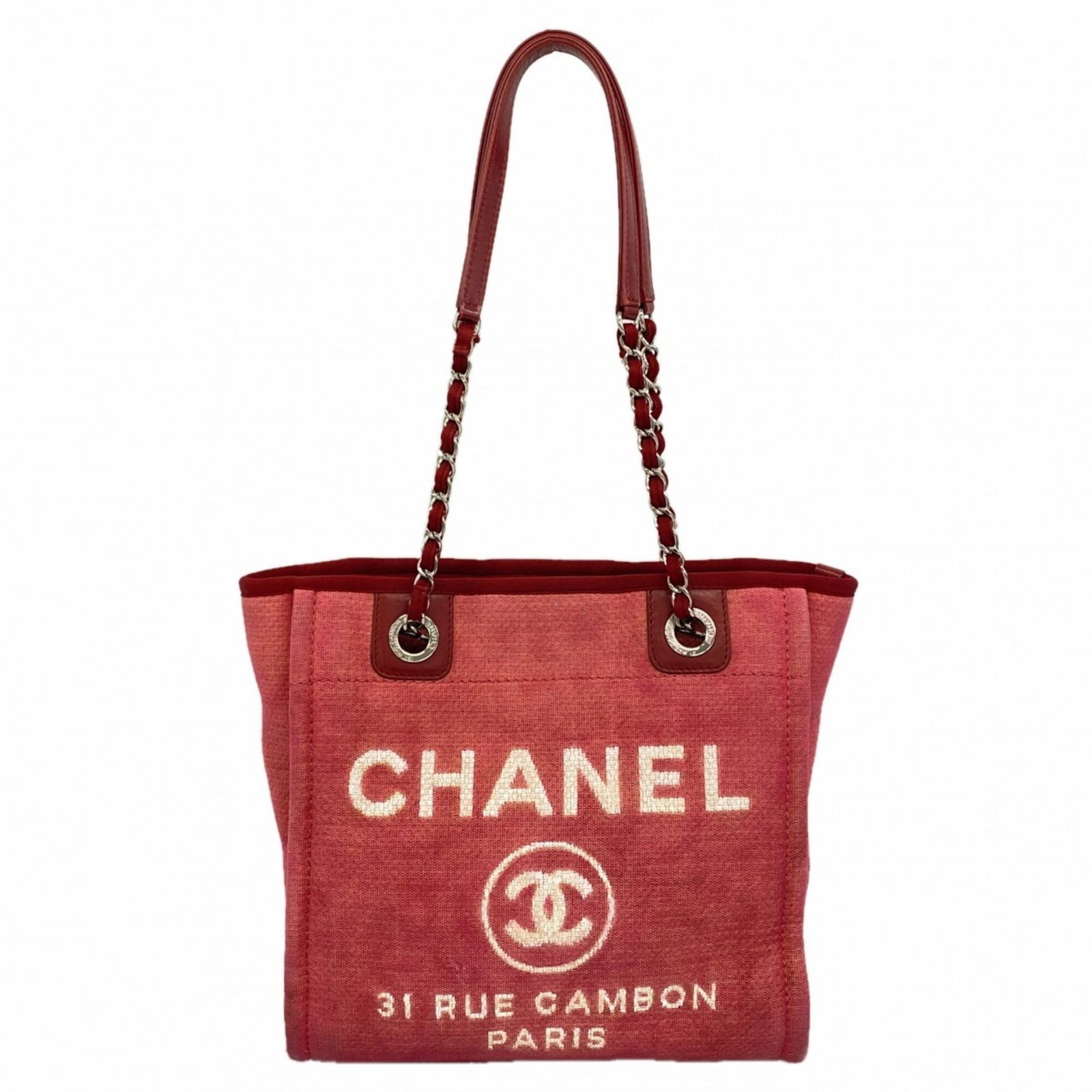 Canvas tote bag from Chanel: Canvas tote bag from Chanel Canvas tote bag from Chanel, featuring a striking red canvas and silver hardware. This classic design boasts a timeless elegance with its clean lines and understated