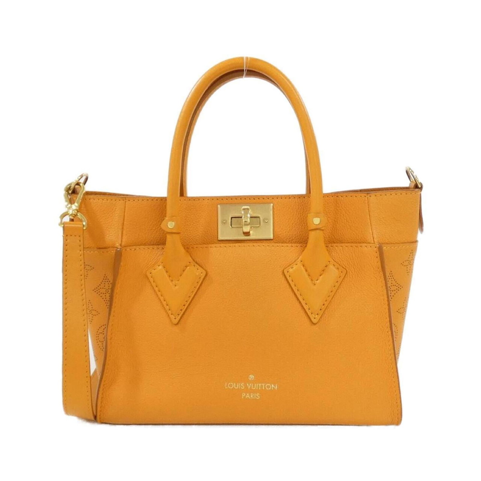 Handbag Leather Louis Vuitton: Handbag Leather Louis Vuitton Gold Orange Louis Vuitton Handbag - Spring/Summer Calfskin Leather. This used handbag features gold and orange tones, a classic design, and leather calfskin material.