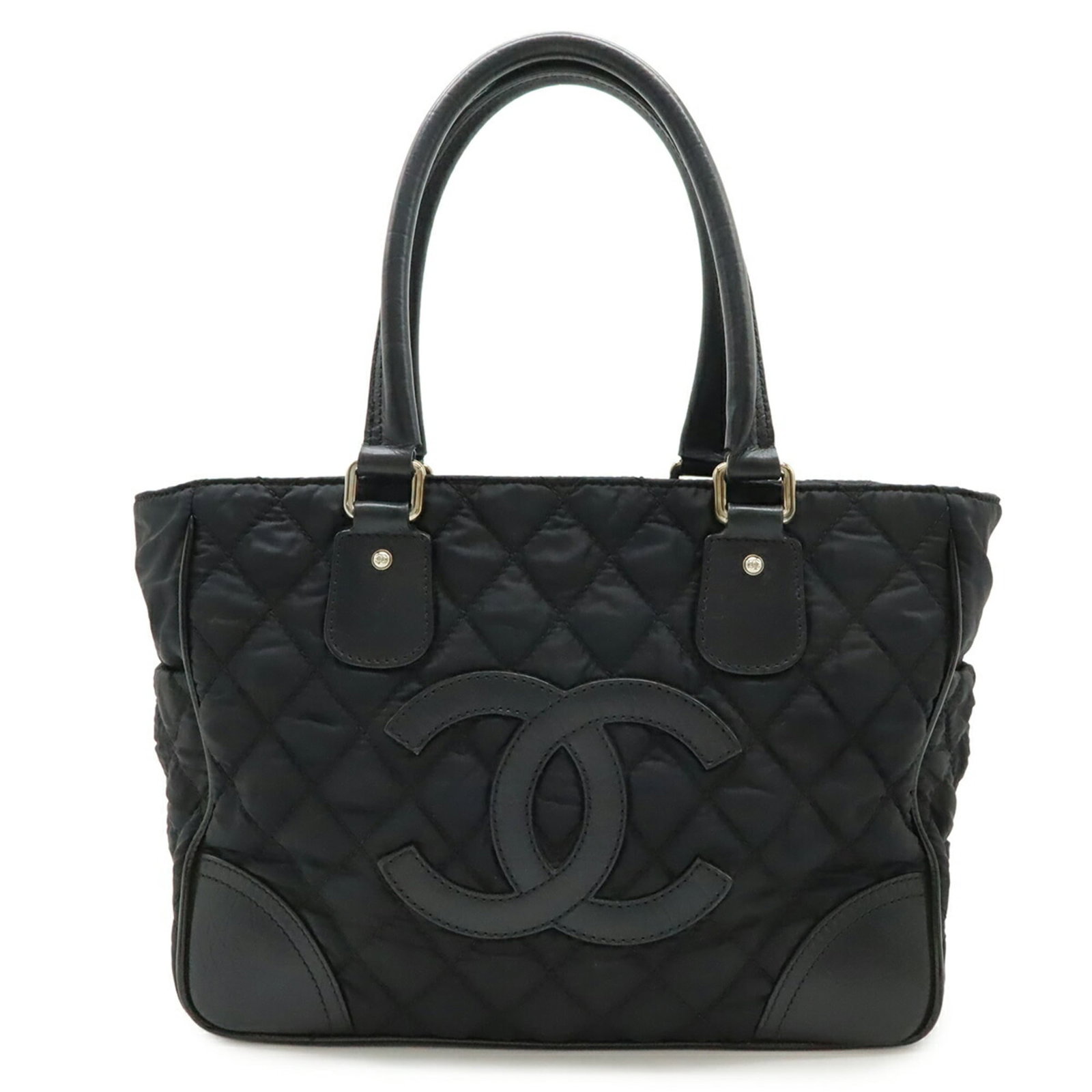 Nylon canvas leather tote bag for Chanel: Nylon canvas leather tote bag for Chanel Nylon canvas leather tote bag for Chanel, featuring a classic design with a black finish. Measuring 26cm x 34cm x 15cm, it has a worn look with traces of usage