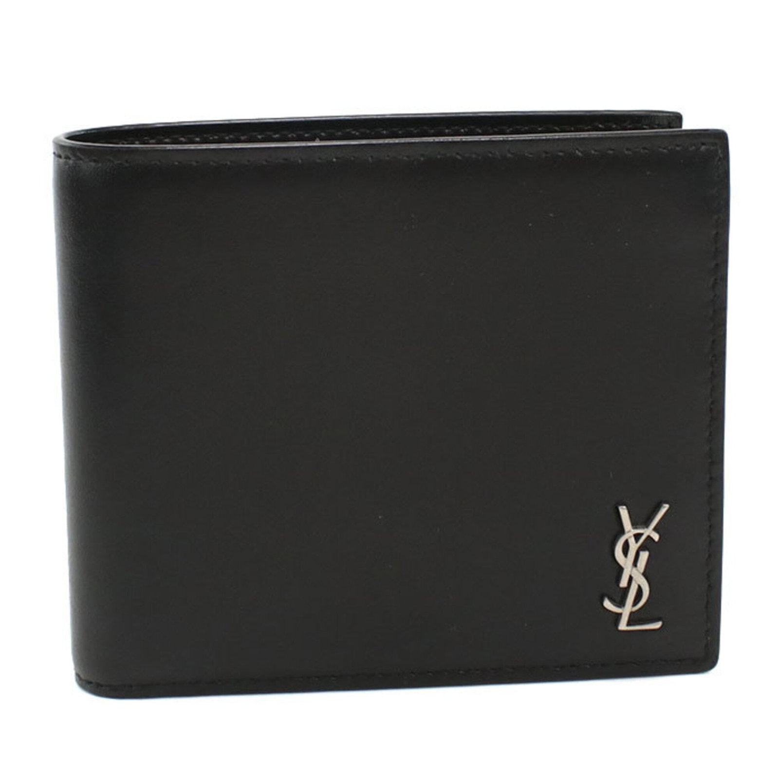 Saint Laurent wallet bi fold leather: Saint Laurent wallet bi fold leather Used Saint Laurent bi-fold leather wallet in black calfskin, featuring a classic design with some minor scratches and dirt. The condition reflects its age, with