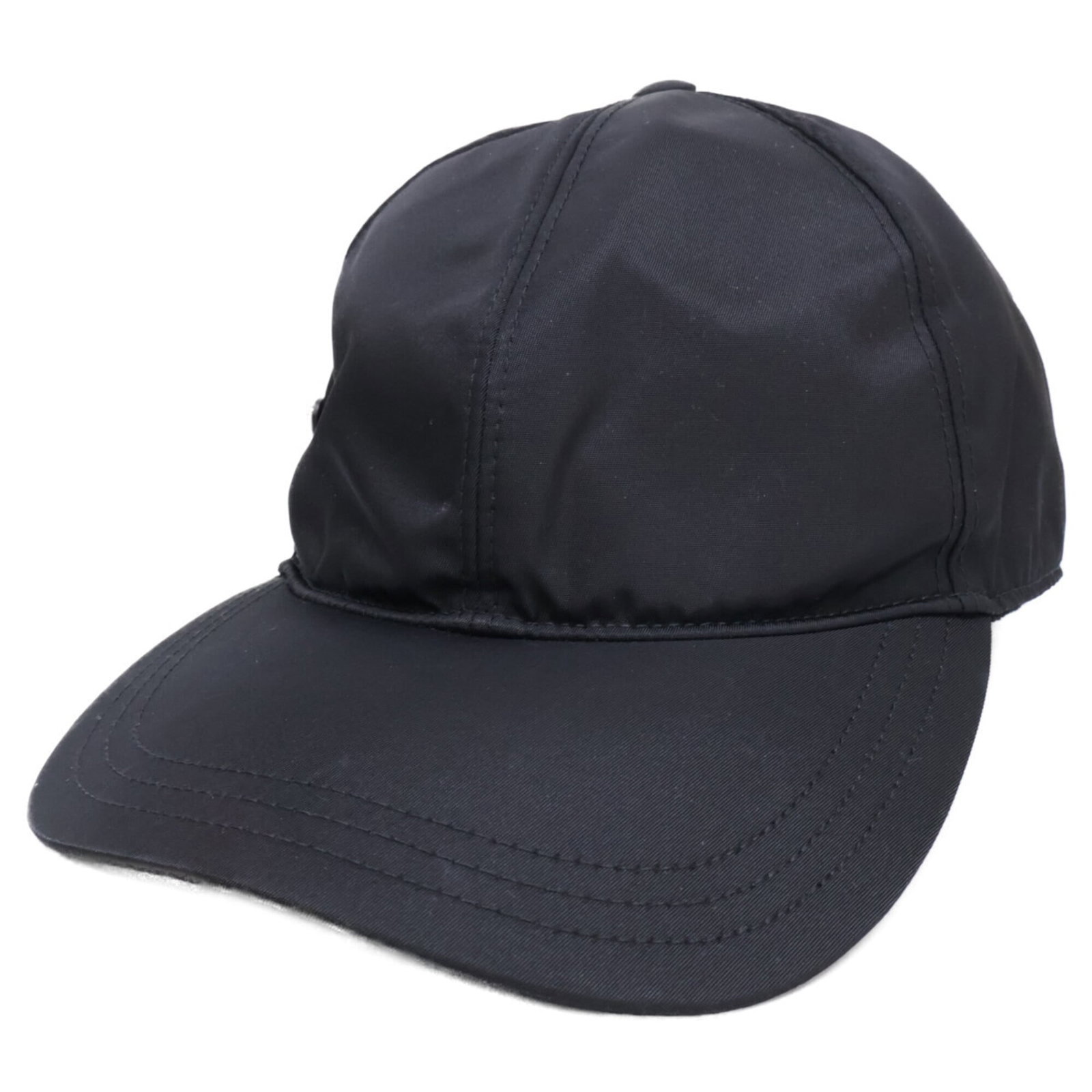 Nylon Prada Cap: Nylon Prada Cap Black nylon Prada cap with traces of usage and minor scratches/dirt, overall in good condition. Made from durable nylon material, this cap showcases the iconic design of the Italian