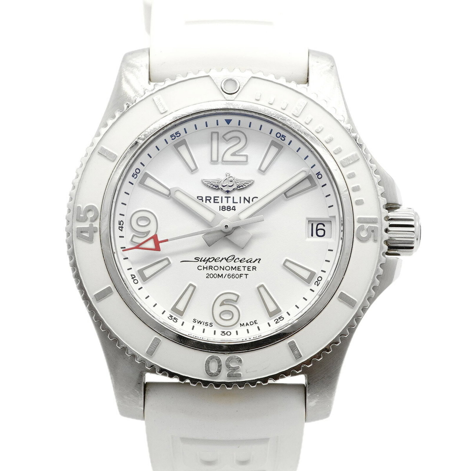 Breitling Wristwatch: Breitling Wristwatch Breitling wristwatch with a white dial and rubber band, measuring 36mm in diameter. The watch has traces of usage, scratches, and dirt but remains in good condition overall. Its