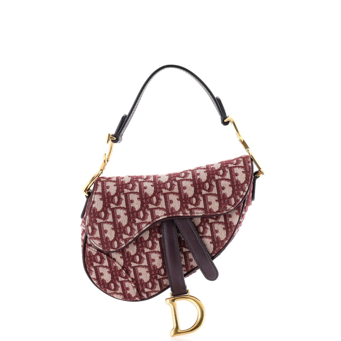 Christian Dior Saddle Handbag Oblique Canvas Mini: Christian Dior Saddle Handbag Oblique Canvas Mini The Christian Dior Saddle Handbag Oblique Canvas Mini boasts a striking red exterior, crafted from plain canvas and adorned with aged gold hardware.