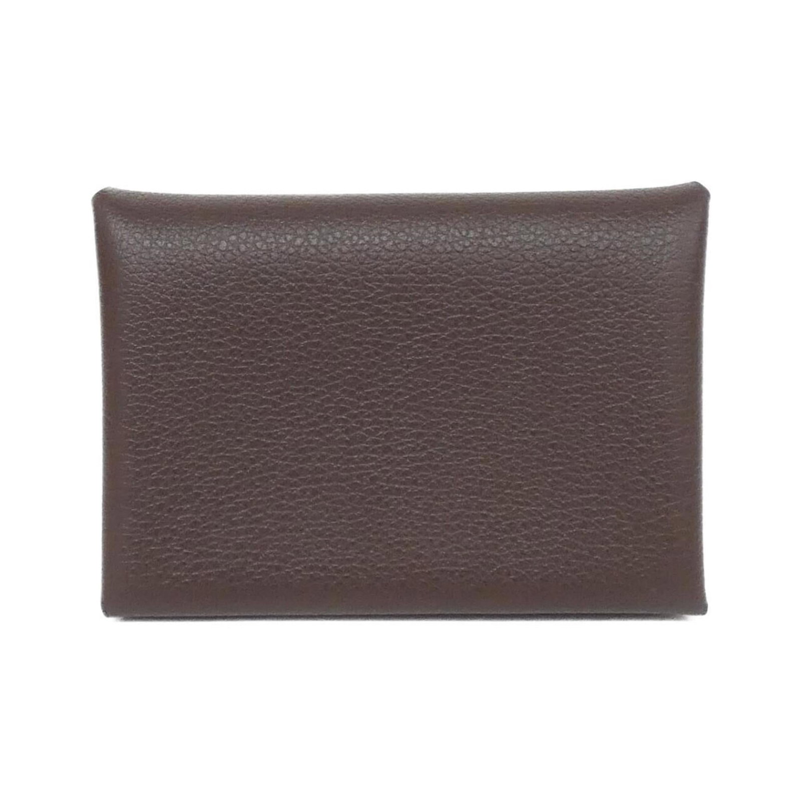 Hermes Coin Purse/ Coin Case: Hermes Coin Purse/ Coin Case The Hermes Coin Purse features a classic design with a mocha color, measuring 7cm x 10.5cm x 1.5cm. This used coin case has some traces of usage and minor scratches/dirt, 