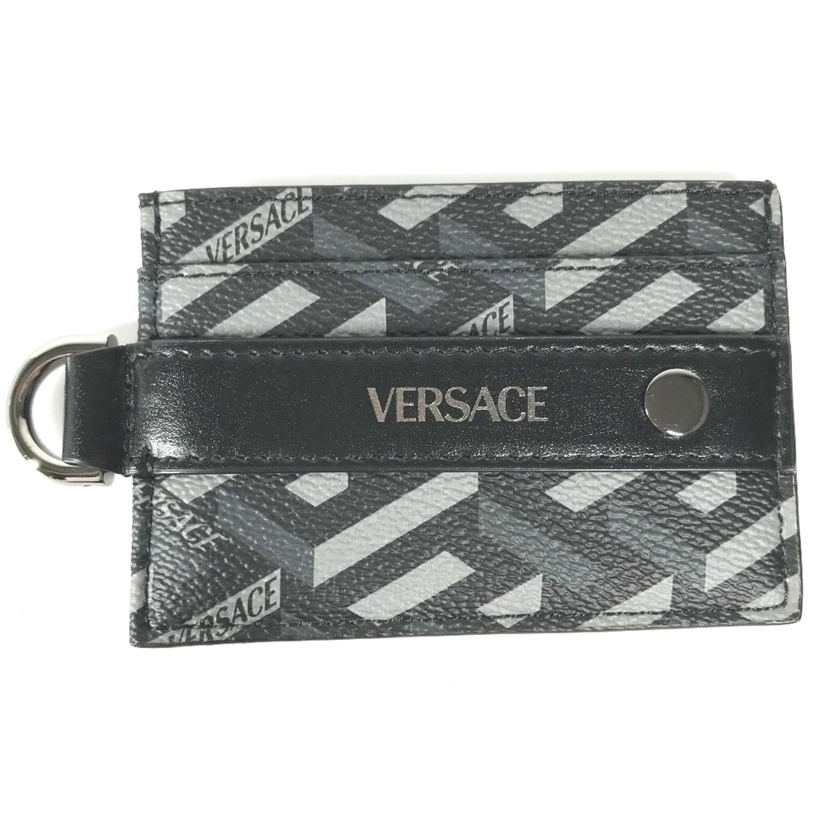 Leather card case Versace: Leather card case Versace Black leather card case from Versace, featuring a sleek design with dimensions of 10cm x 7cm and 3.9cm x 2.8cm. Made from high-quality leather, this card case is in very good