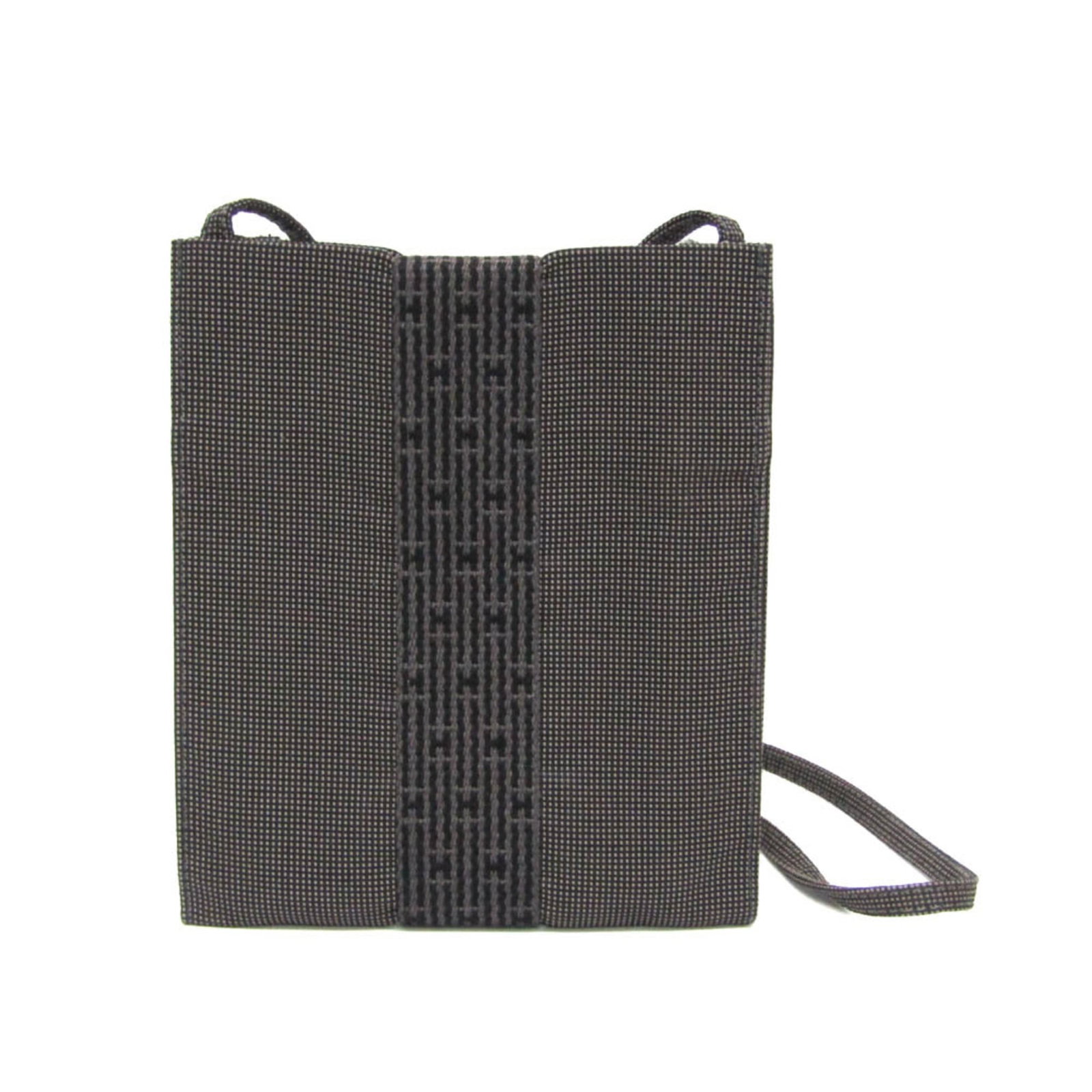 Polyamide polyester shoulder bag by Hermes: Polyamide polyester shoulder bag by Hermes Polyamide polyester shoulder bag by Hermes features a sleek gray color and open closure. Made from durable polyamide and polyester materials, this versatile