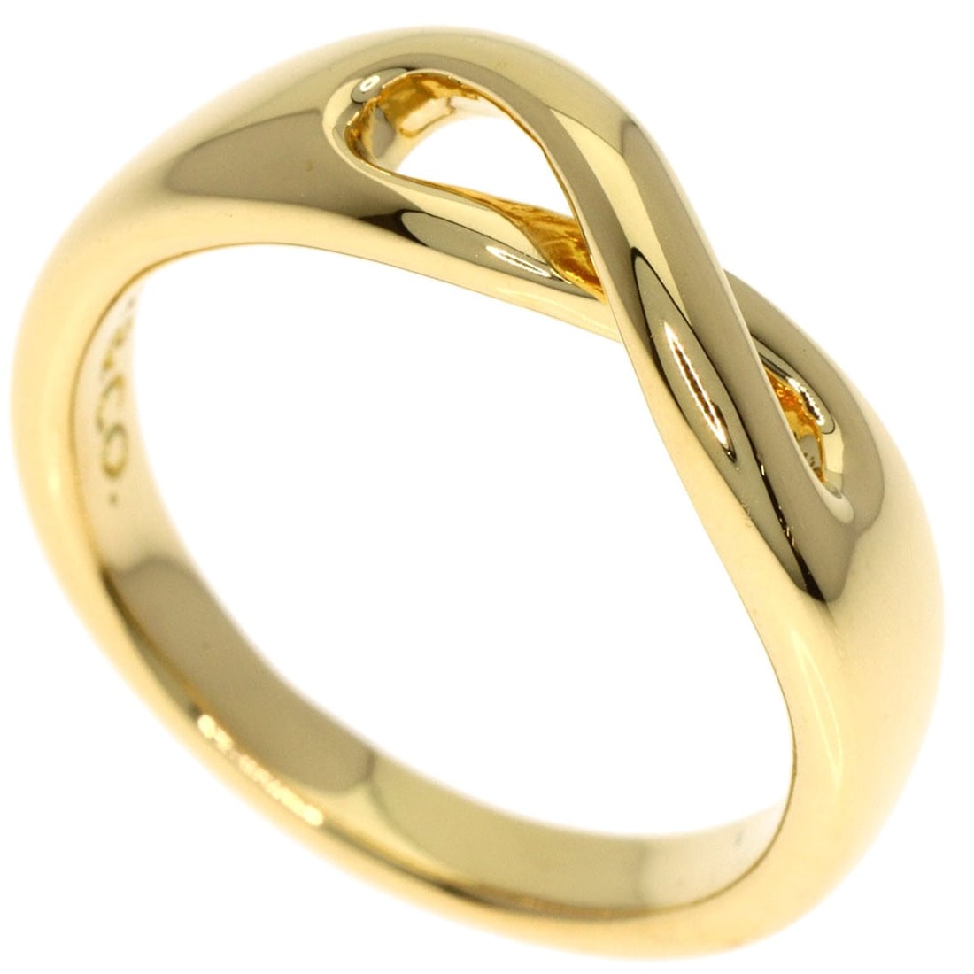 K18 yellow gold infinity ring by Tiffany Co: K18 yellow gold infinity ring by Tiffany Co K18 yellow gold infinity ring by Tiffany Co, featuring a sleek and modern design with a focus on the signature metal purity. This piece showcases the