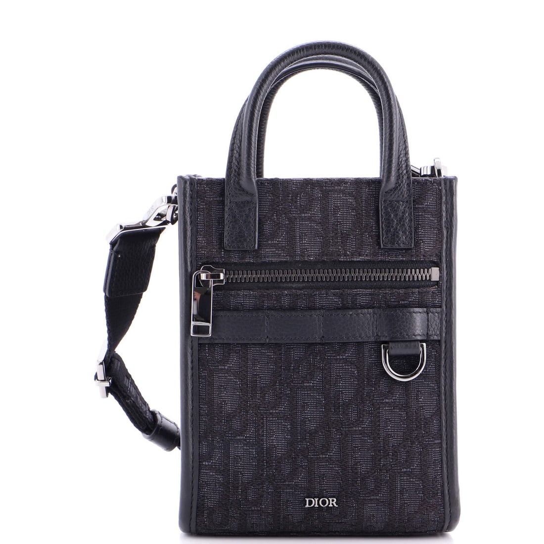 Christian Dior Mini Oblique Canvas Convertible Tote Safari North South: Christian Dior Mini Oblique Canvas Convertible Tote Safari North South Black canvas mini tote with oblique design, featuring a convertible style and detachable strap. The exterior shows minor edge