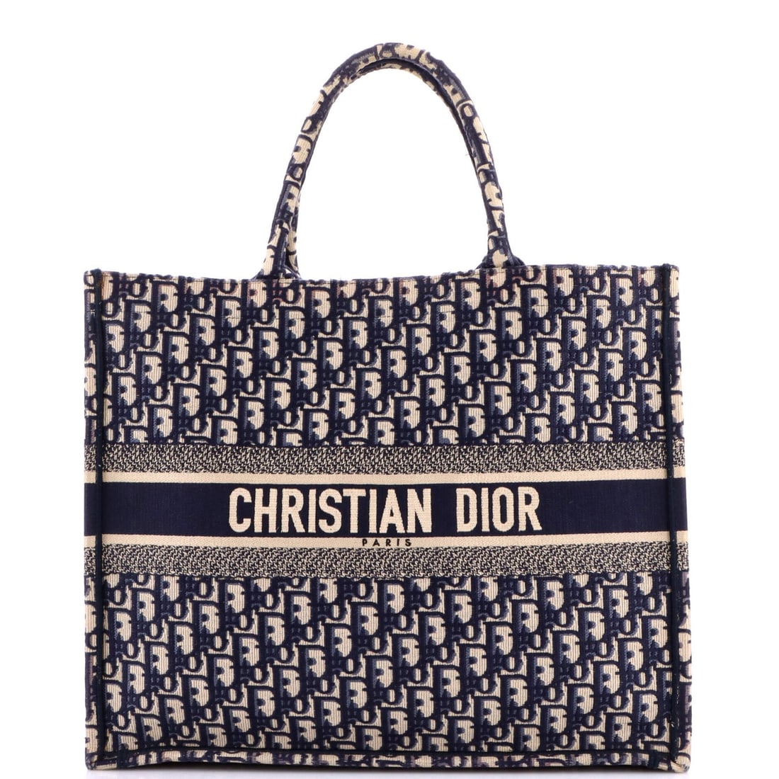 Oblique canvas book Christian Dior Large tote: Oblique canvas book Christian Dior Large tote Blue Oblique Canvas Large Christian Dior Book Tote measures 13.5" high, 17" wide, and 7" deep with a handle drop of 6.5". The exterior canvas is blue and 