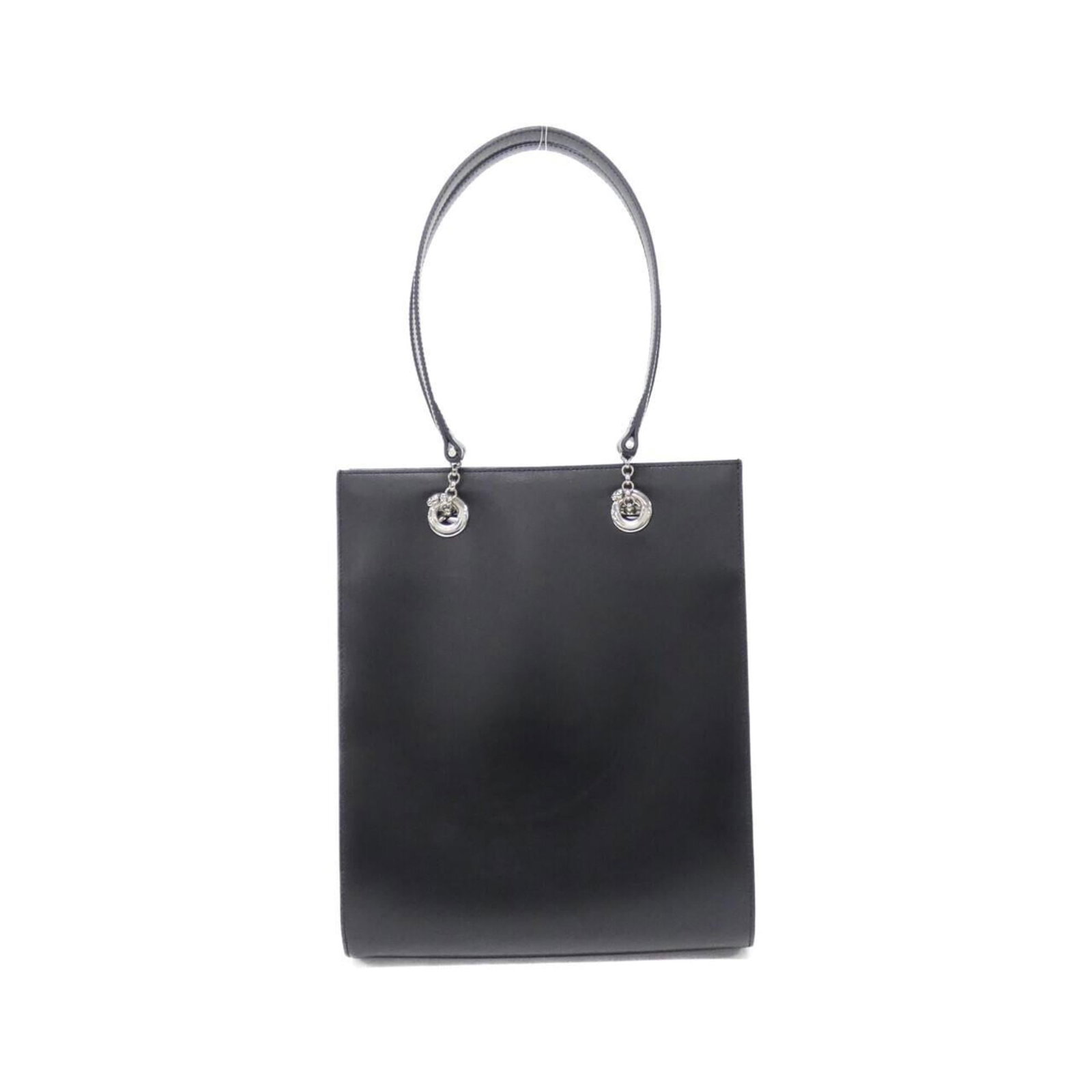 Handbag Leather by Cartier: Handbag Leather by Cartier Cartier's iconic black leather handbag boasts sleek, silver hardware and a sophisticated calfskin finish. Measuring 29cm x 23.5cm x 10cm, it features a sturdy handle that