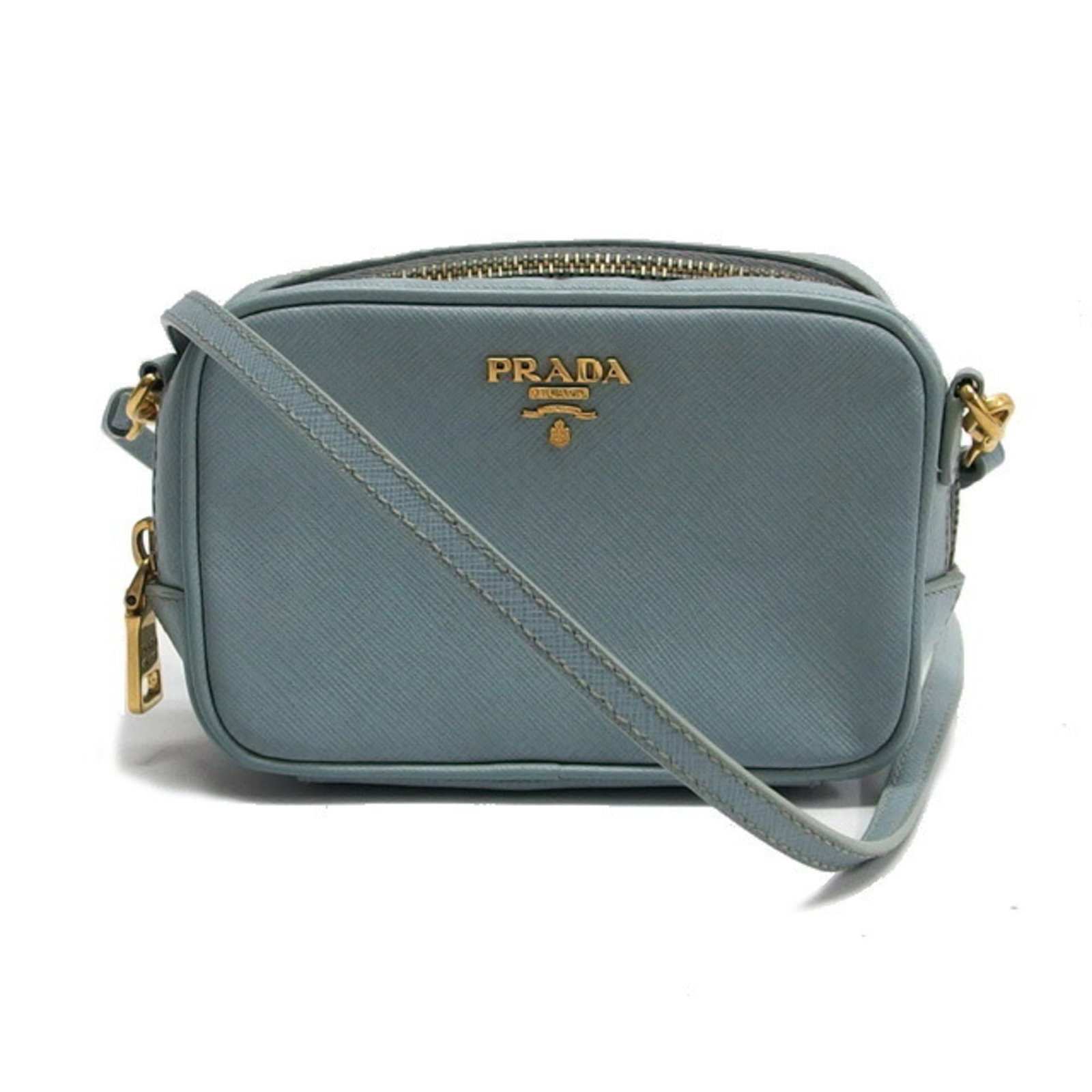 Prada Pochette Shoulder Bag Leather: Prada Pochette Shoulder Bag Leather Light blue embossed leather Prada Pochette Shoulder Bag in very good condition, with a few traces of usage and some minor scratches/dirt. A stylish and compact shou