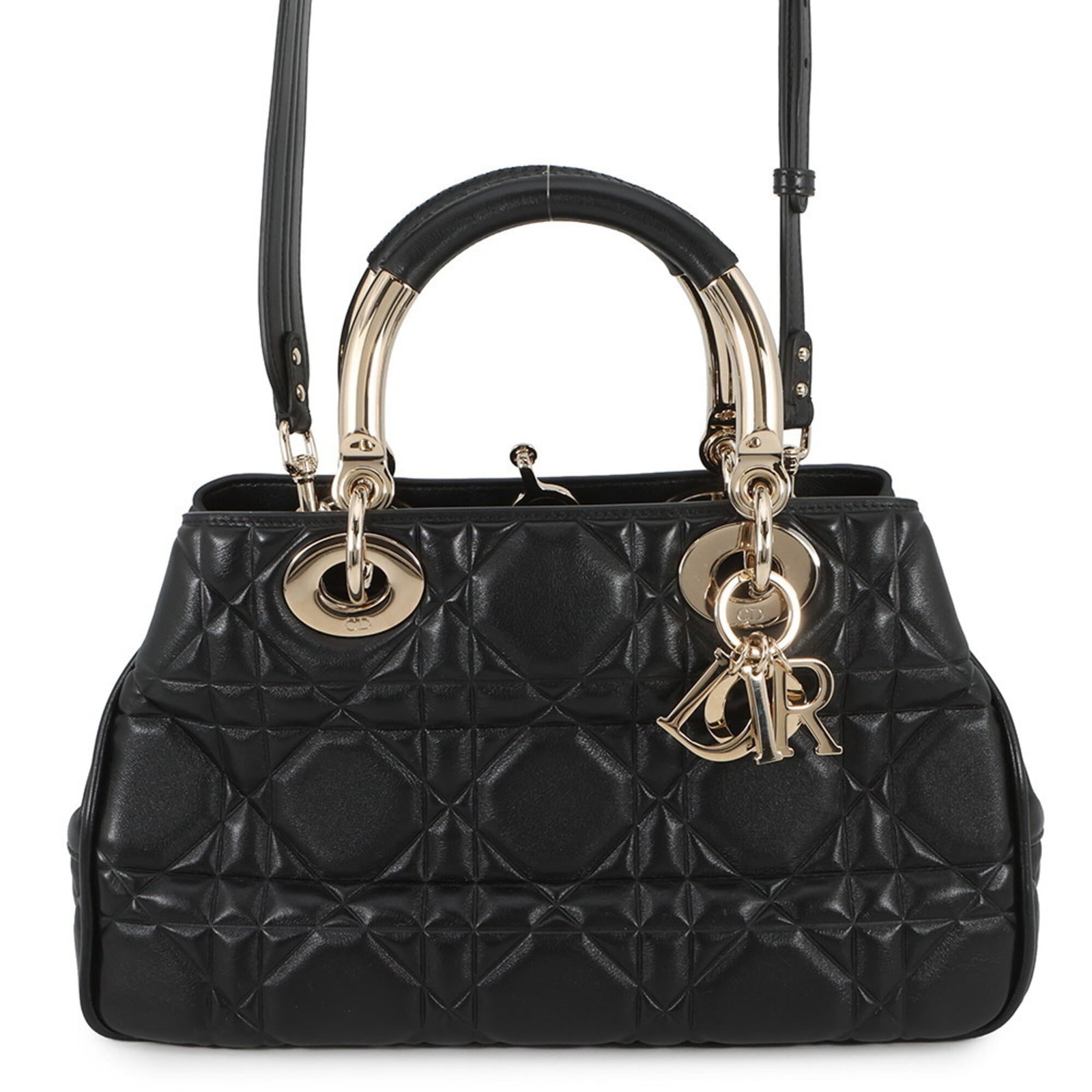 Handbag of leather by Christian Dior: Handbag of leather by Christian Dior This black leather handbag by Christian Dior features a classic design with a timeless aesthetic. Made from high-quality leather, it boasts a sleek and