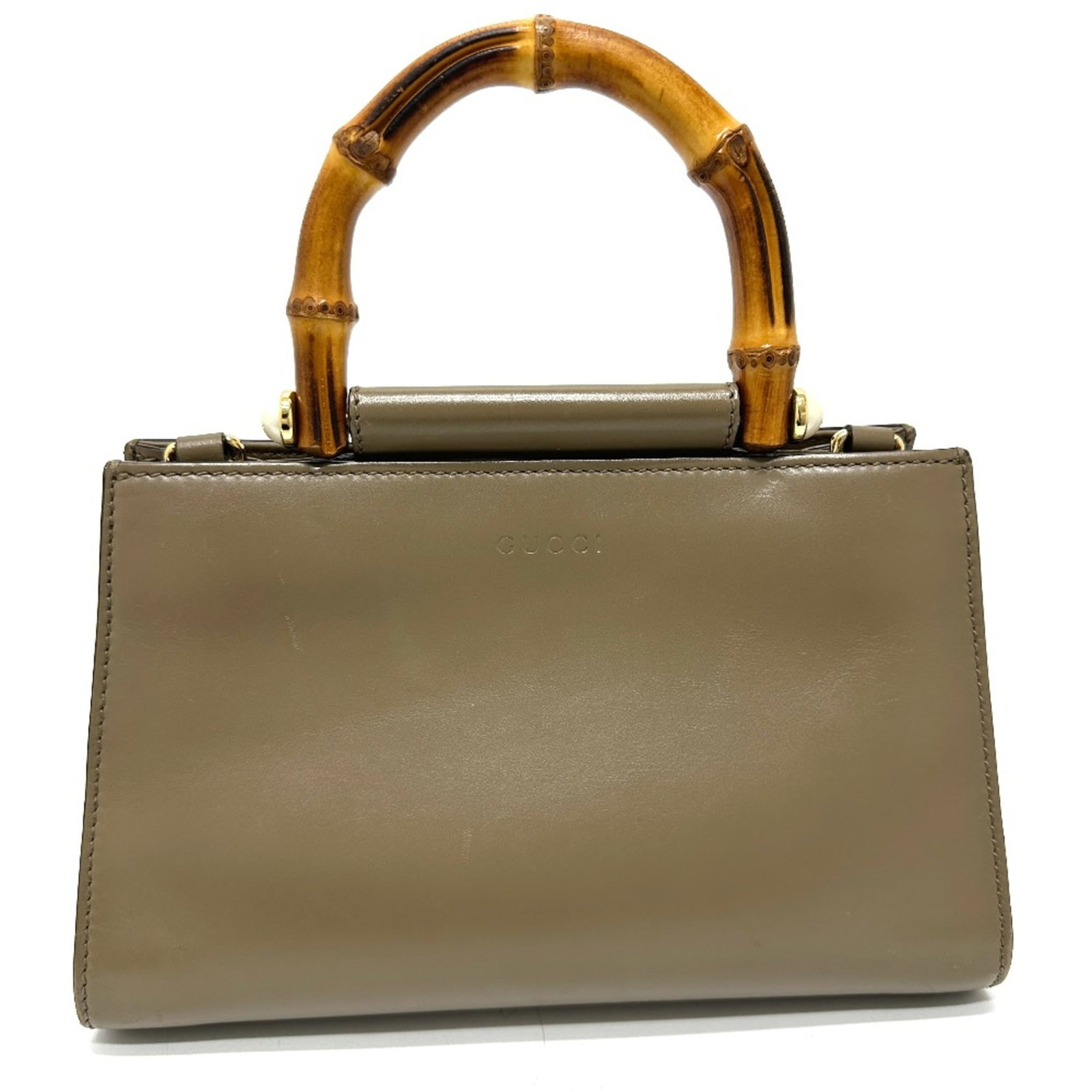 Handbag Leather Gucci: Handbag Leather Gucci Brown leather Gucci handbag with a classic design, featuring a brown color and a signature style. Made from high-quality leather, this bag measures 16cm x24cm x10cm and has a