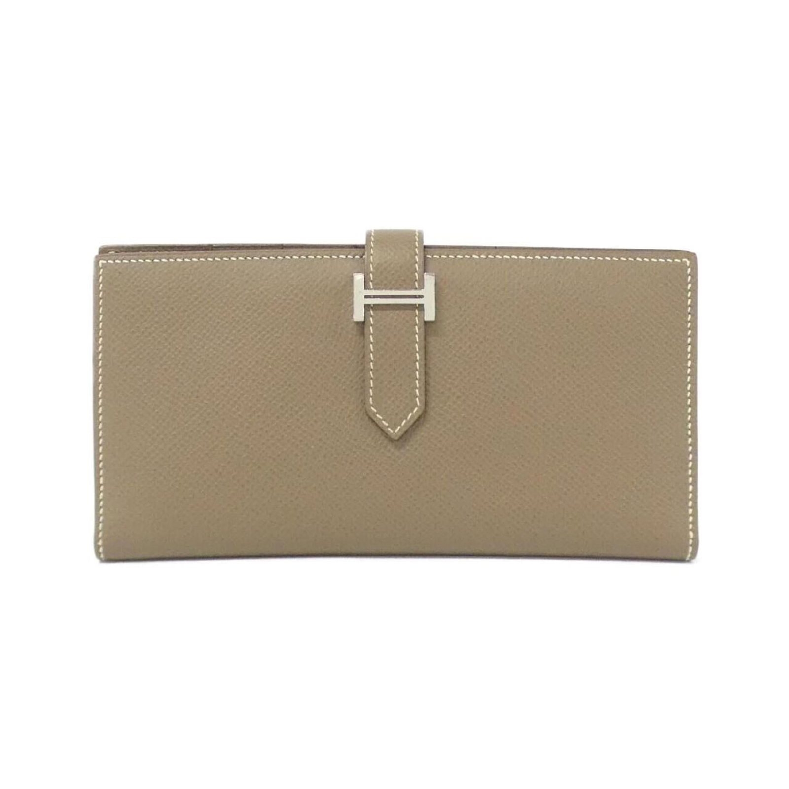 Hermes Long Wallet (Bi-Fold) Epsom Leather: Hermes Long Wallet (Bi-Fold) Epsom Leather Etoupe Gray Epsom Leather Hermes Long Wallet (Bi-Fold) boasts classic design with a timeless appeal. Made from high-quality Epsom leather, its bi-fold struct