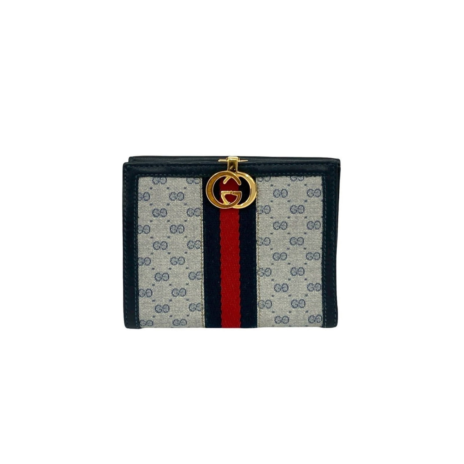 PVC Leather Gucci Bi Fold Wallet: PVC Leather Gucci Bi Fold Wallet Navy and red accents add a pop of color to this Gucci bi-fold wallet, made from a combination of leather and PVC. The classic design features a sleek, compact shape