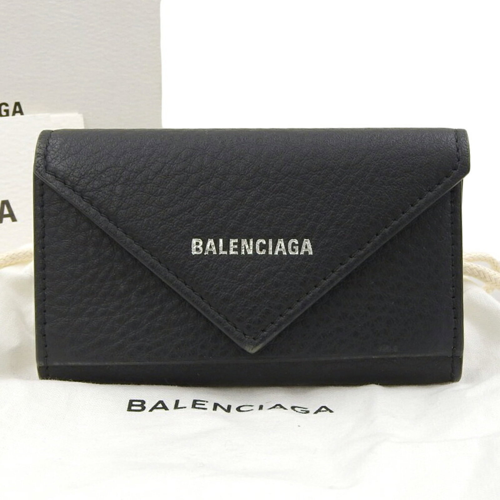 Keycase Leather By Balenciaga: Keycase Leather By Balenciaga Keycase Leather By Balenciaga. Made from high-quality leather, this keycase features a sleek black design that exudes luxury and sophistication. With some minor scratches