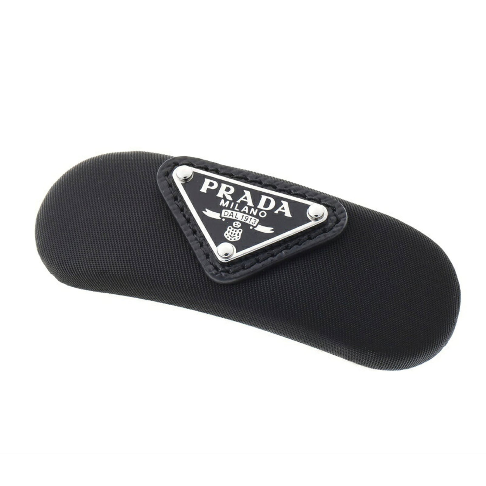 Metal Nylon Hair Clip Prada: Metal Nylon Hair Clip Prada Black Metal Nylon Hair Clip from Prada, featuring a sleek and modern design. The clip's metal and nylon construction gives it a durable and stylish look, with some minor