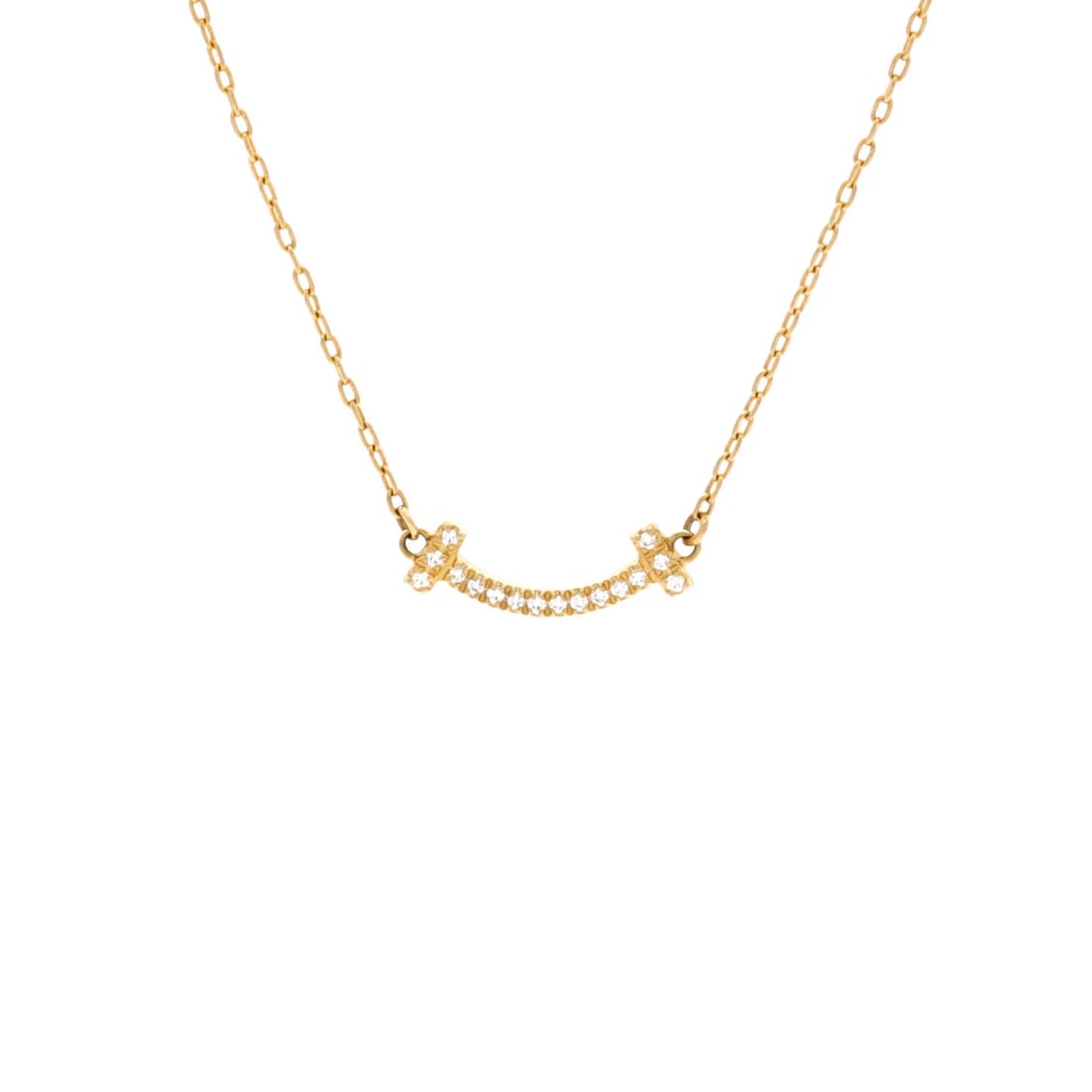 Tiffany & Co. T Smile Pendant Necklace 18K Yellow Gold with Diamonds Mini: Tiffany & Co. T Smile Pendant Necklace 18K Yellow Gold with Diamonds Mini Tiffany & Co.'s T Smile Pendant Necklace shines in 18K yellow gold, adorned with a miniature diamond. The necklace's delicate