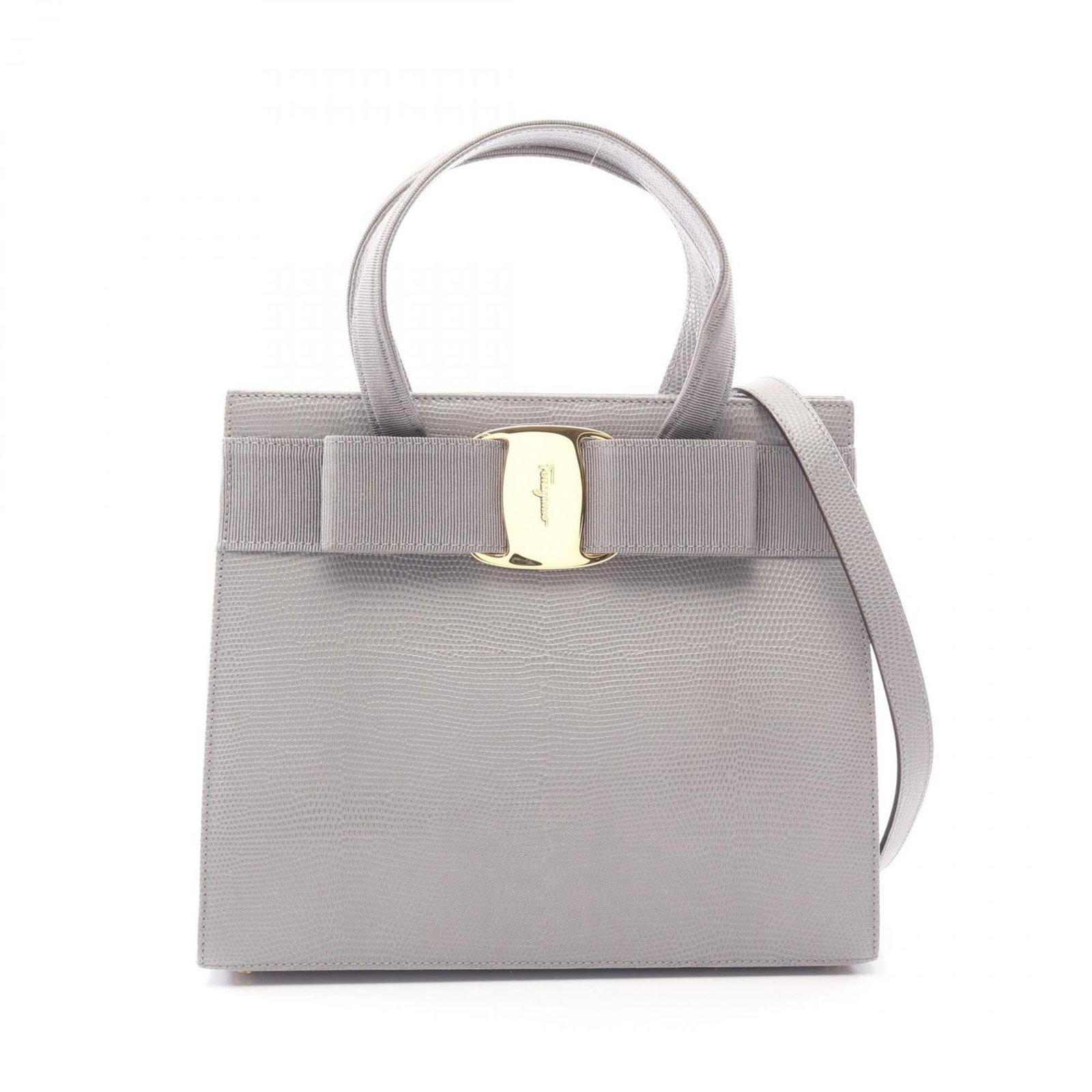 Handbag Leather by Salvatore Ferragamo: Handbag Leather by Salvatore Ferragamo Gray leather handbag by Salvatore Ferragamo, featuring a classic design with a subtle gray hue. Made from high-quality leather with some scratches and dirt