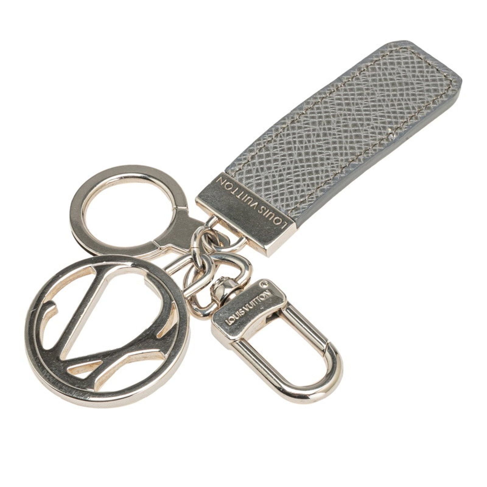 Louis Vuitton Keyring Leather Metal: Louis Vuitton Keyring Leather Metal The Louis Vuitton Keyring Leather Metal features a unique combination of leather and metal craftsmanship, with a Glacier, Gray color that adds a touch of sophistica