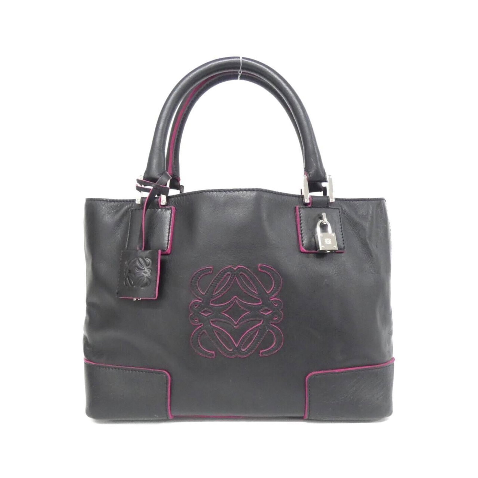 Leather Handbag Loewe: Leather Handbag Loewe This black leather Loewe handbag boasts sleek silver hardware and a sophisticated design. With its classic size and weight, it's perfect for everyday use. The bag shows some