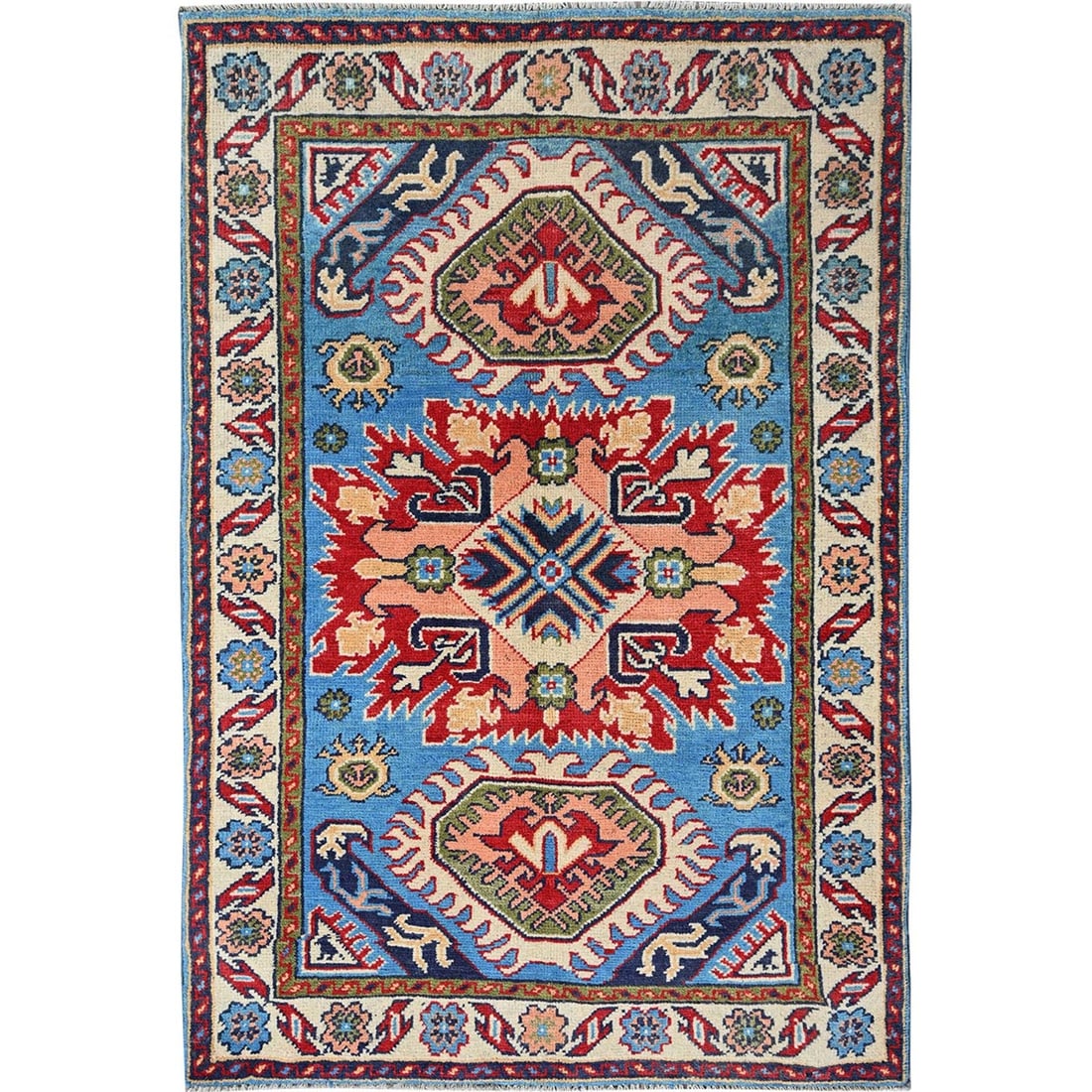Blue Kazak rug geometric design hand knotted soft wool mat sample: Blue Kazak rug geometric design hand knotted soft wool mat sample Soft and vibrant, this hand-knotted Blue Kazak rug features a stunning geometric design in shades of blue, green, peach, and ivory.