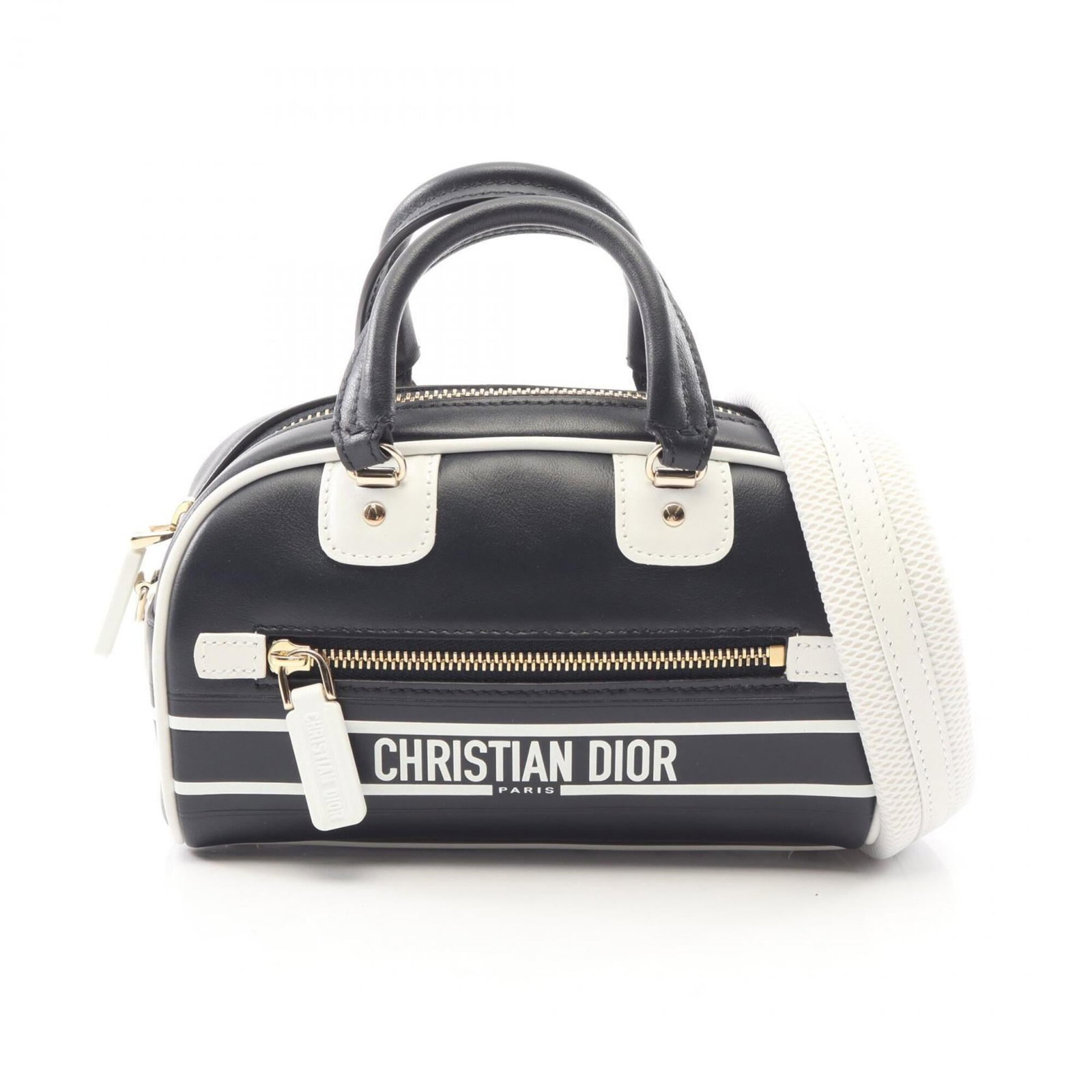 Handbag of leather by Christian Dior: Handbag of leather by Christian Dior Black and white leather handbag by Christian Dior, featuring a classic design with a timeless appeal. The bag measures 11cm x 17cm x 8cm and comes with adjustable