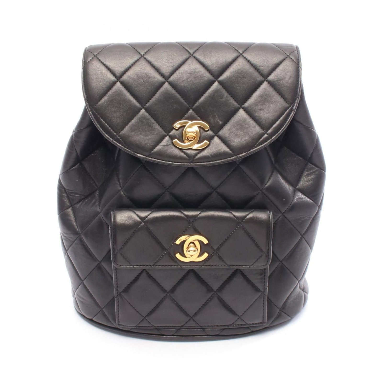 Backpack Leather by Chanel: Backpack Leather by Chanel Black Lambskin Leather Backpack by Chanel, with gold hardware and a classic design. This used backpack features a few traces of usage, some scratches and dirt, but overall