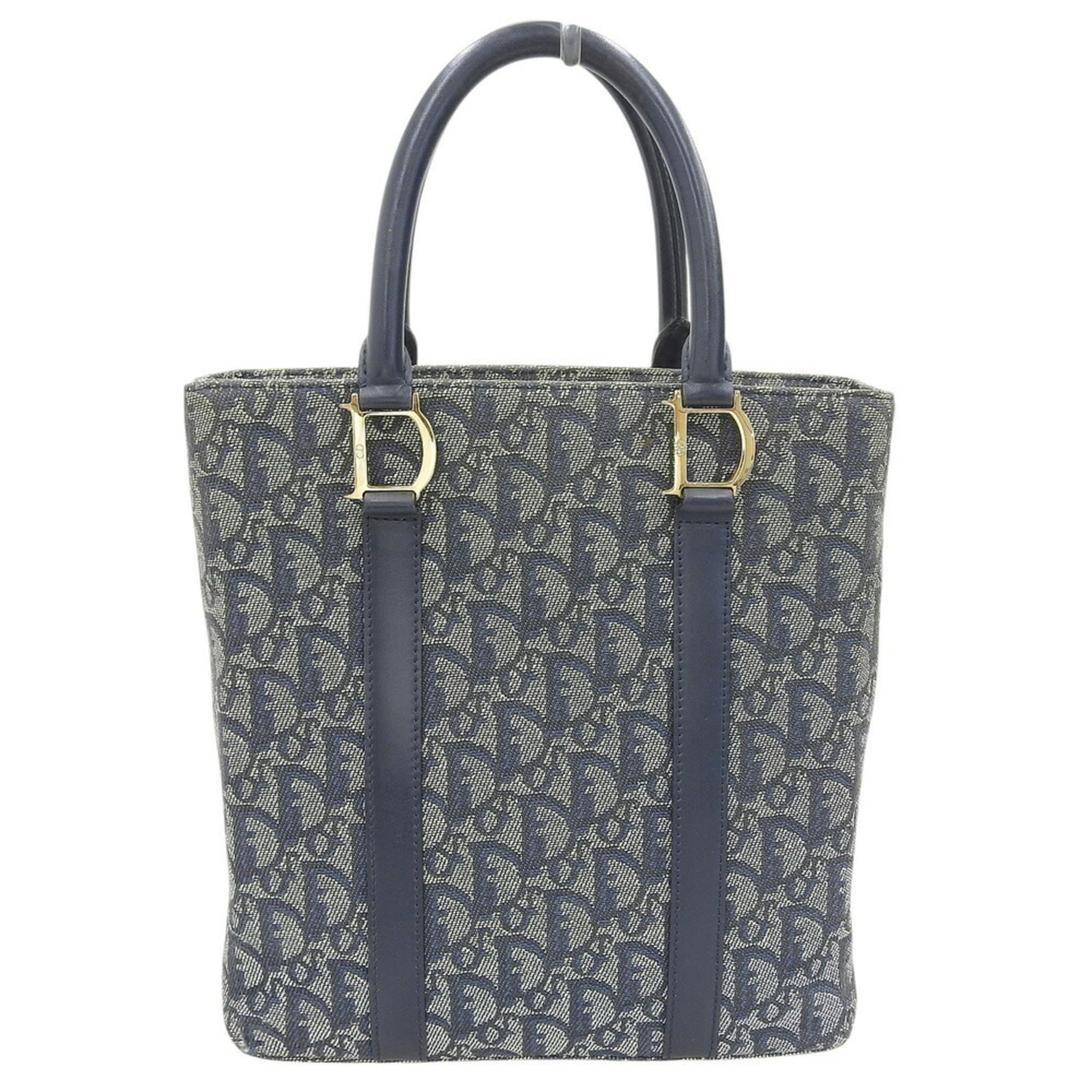Christian Dior Handbag Tote Bag Trotter Leather Canvas: Christian Dior Handbag Tote Bag Trotter Leather Canvas The Christian Dior Trotter Leather Canvas Tote Bag boasts a classic design with a navy color and gold hardware, making it a timeless addition to
