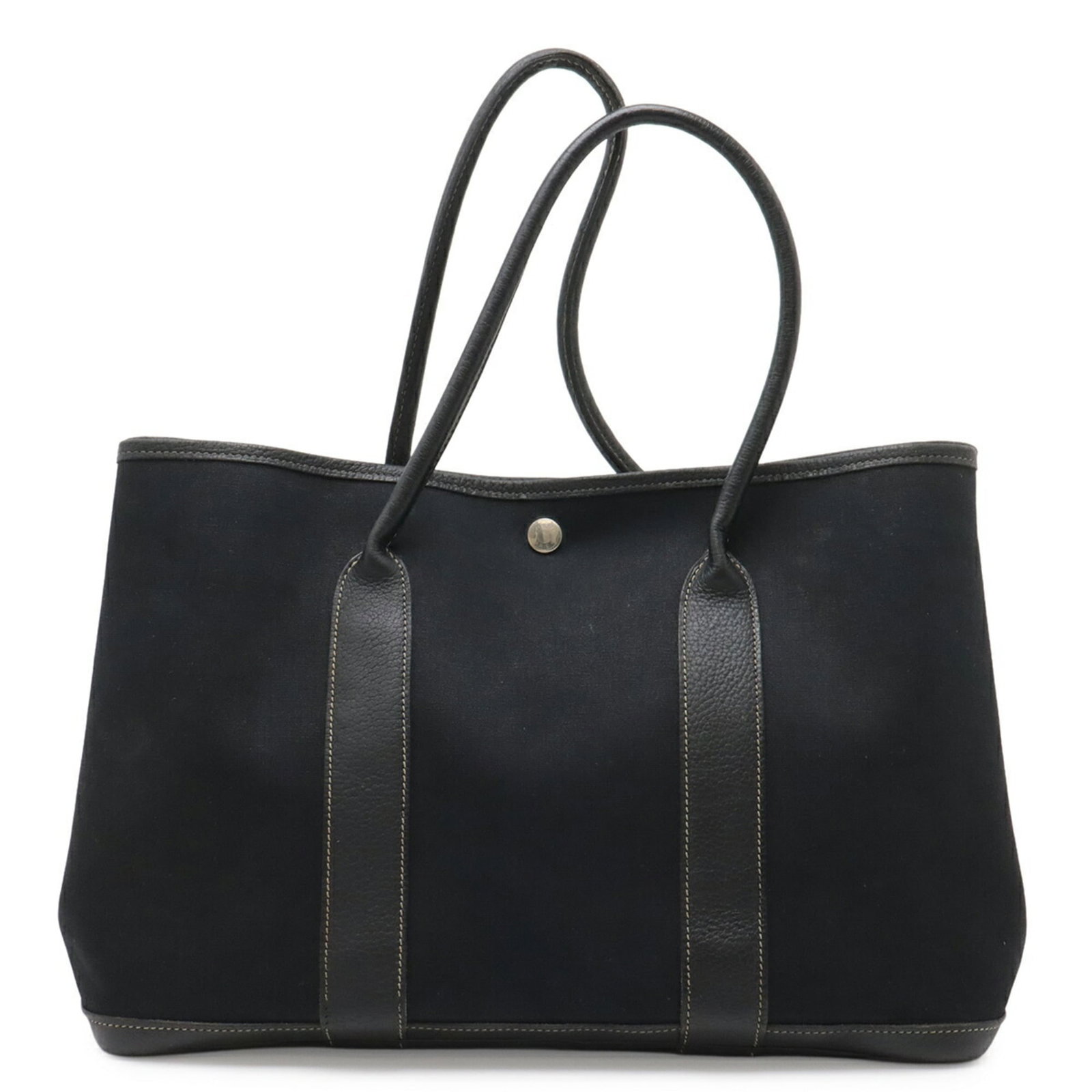 Hermes Handbag Tote Bag Toile Officier Leather: Hermes Handbag Tote Bag Toile Officier Leather Toile Officier Leather Handbag Tote Bag from Hermes. This used tote bag features the iconic Toile Officier design in black leather, with traces of usage