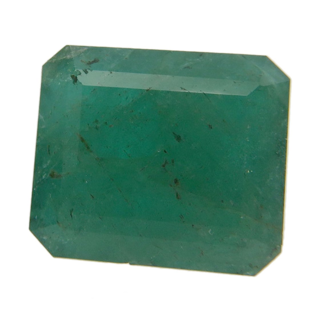 Emerald Loose 1.2G: Emerald Loose 1.2G Loose emerald weighing 6.29ct, showcasing its vibrant green color in a natural setting. This high-quality gemstone is carefully presented in its raw state, allowing for a unique
