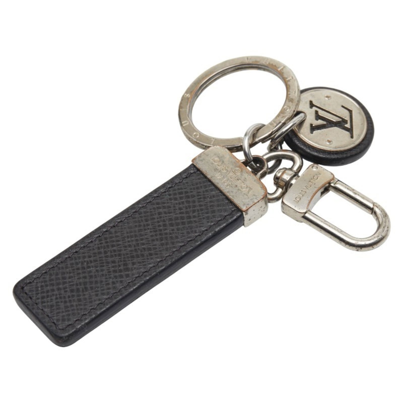 Louis Vuitton Keyring Leather Metal: Louis Vuitton Keyring Leather Metal This Louis Vuitton Keyring Leather Metal features a sleek design with a combination of black leather and silver accents. The keyring measures 13.5cm x 2.5cm,