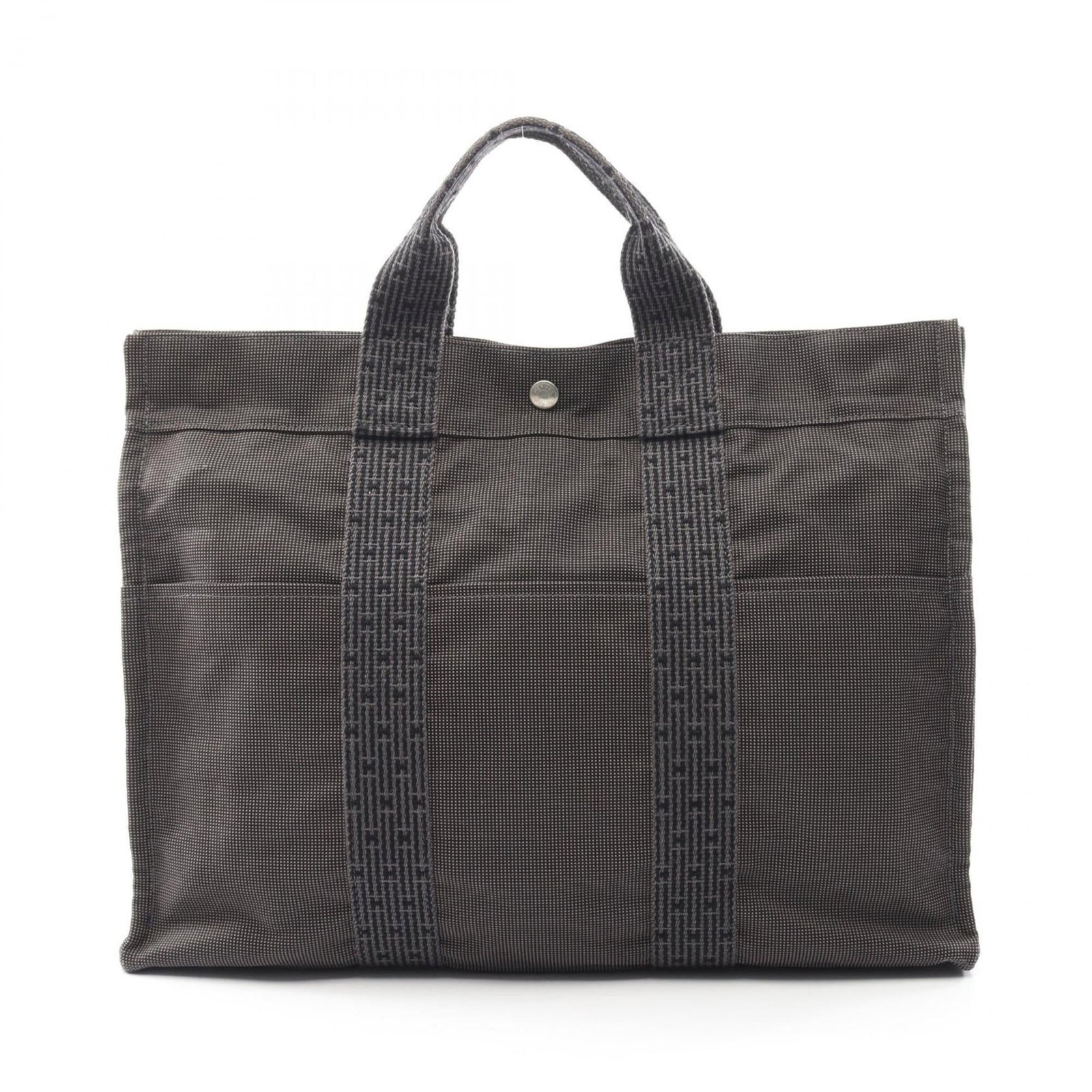 Hermes tote nylon canvas bag: Hermes tote nylon canvas bag Gray Hermes tote nylon canvas bag, measuring 32cm x 42cm x 11cm, features a durable nylon canvas material with traces of usage and minor scratches. The bag's classic