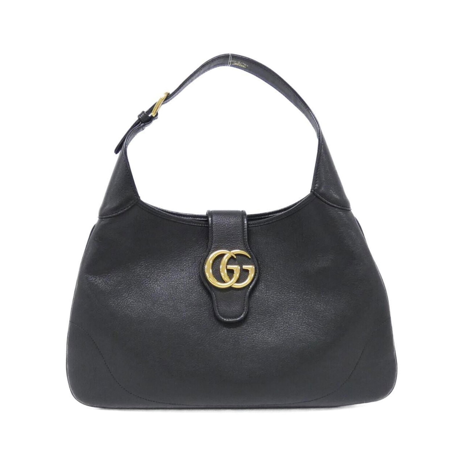 Shoulder Bag Leather Gucci: Shoulder Bag Leather Gucci This black leather Gucci shoulder bag features a classic design with clean lines and a timeless aesthetic. With its durable construction and subtle scratches, it has been