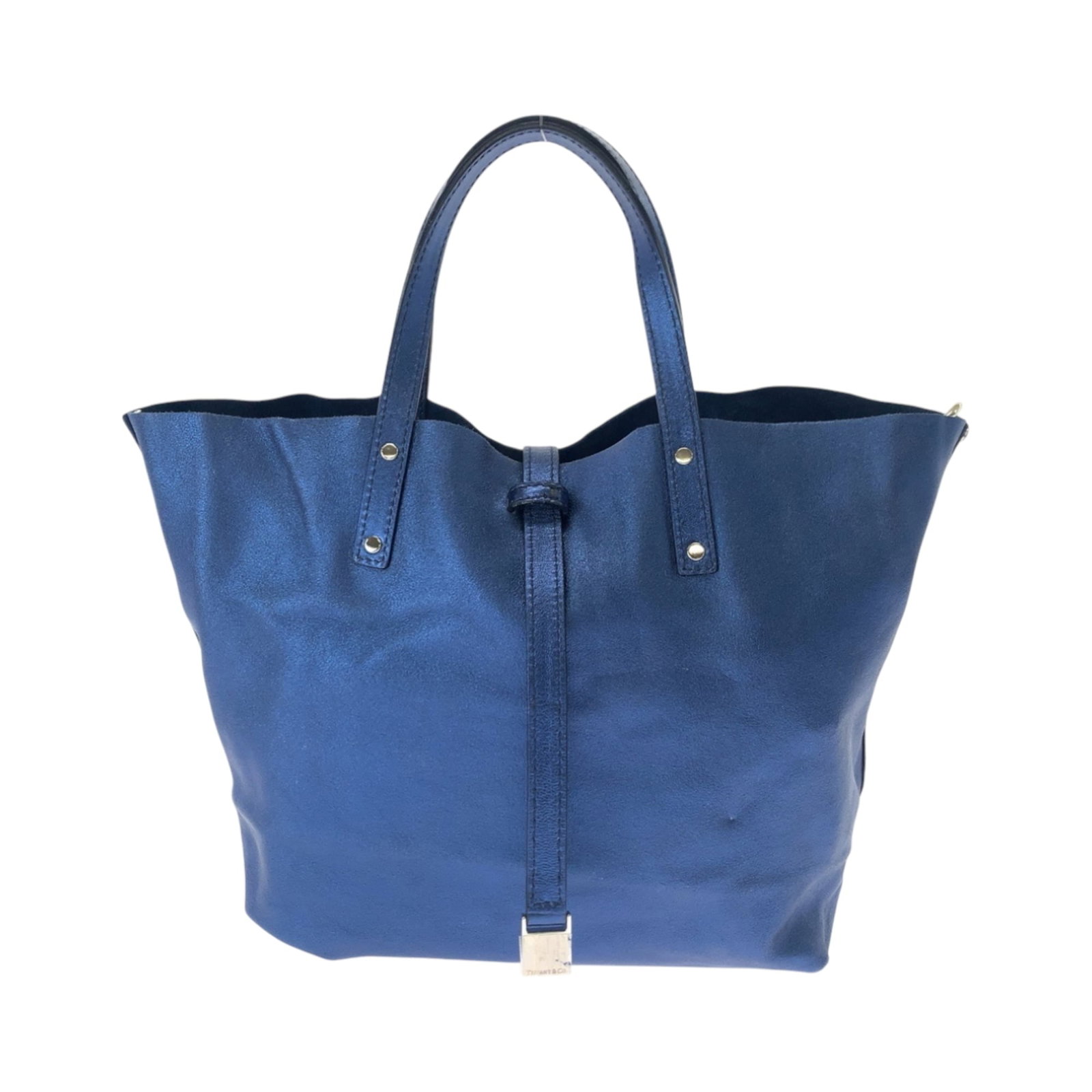 Handbag of Leather by Tiffany: Handbag of Leather by Tiffany The Tiffany leather handbag boasts a stunning metallic blue hue and sleek silver hardware, adding an air of sophistication to its classic design. Made from high-quality l