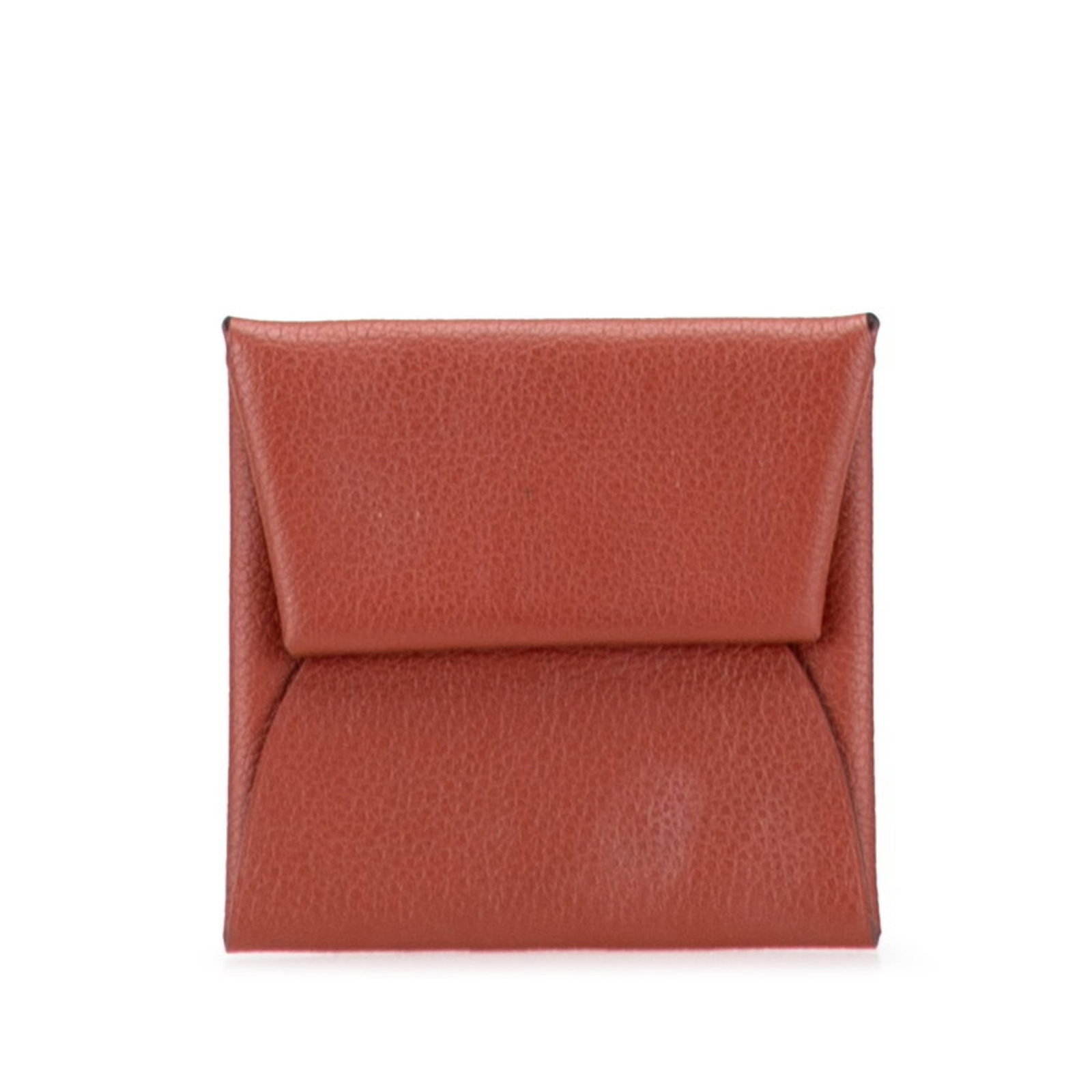 Hermes Coin Purse/ Coin Case: Hermes Coin Purse/ Coin Case Used Hermes Coin Purse in brown, with traces of usage and minor scratches. The compact design measures 8cm x 3.14'' x 0.19''. A small, worn coin case from a well-known