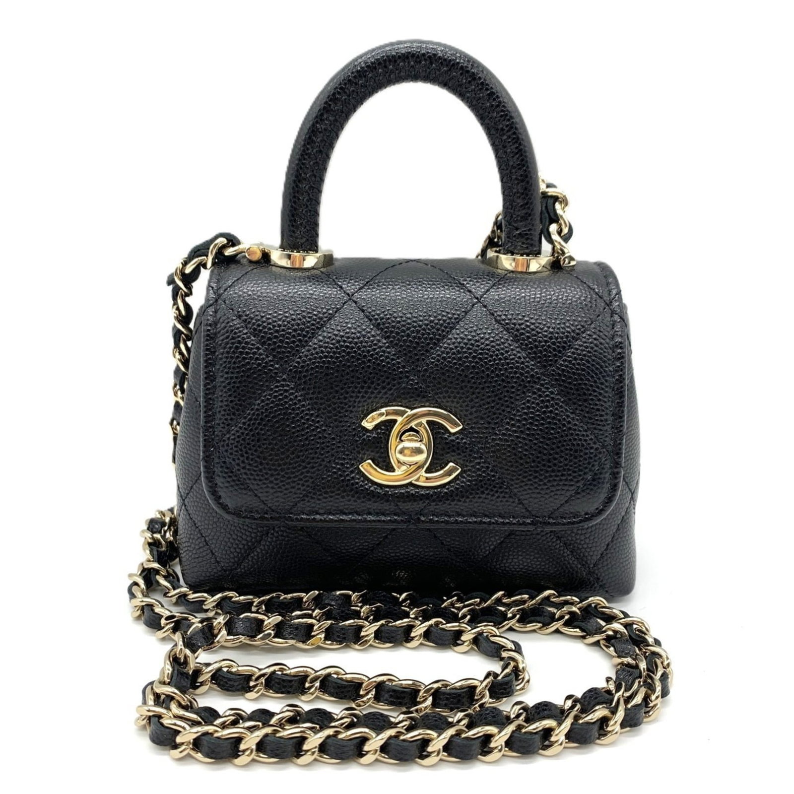 Calfskin shoulder bag by Chanel: Calfskin shoulder bag by Chanel Calfskin shoulder bag by Chanel features a sleek, all-black design with a turn lock closure. The bag measures 9cm x 12cm x 4cm and has adjustable straps that reach