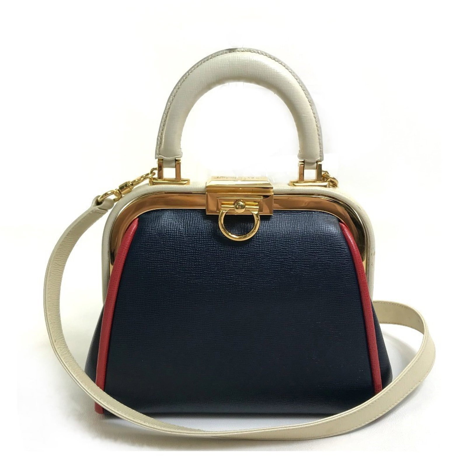 Handbag of leather by Christian Dior: Handbag of leather by Christian Dior Navy leather handbag by Christian Dior, featuring classic design and timeless elegance. Measuring 16cm x19cm x8.5cm, it boasts a shoulder strap that extends to