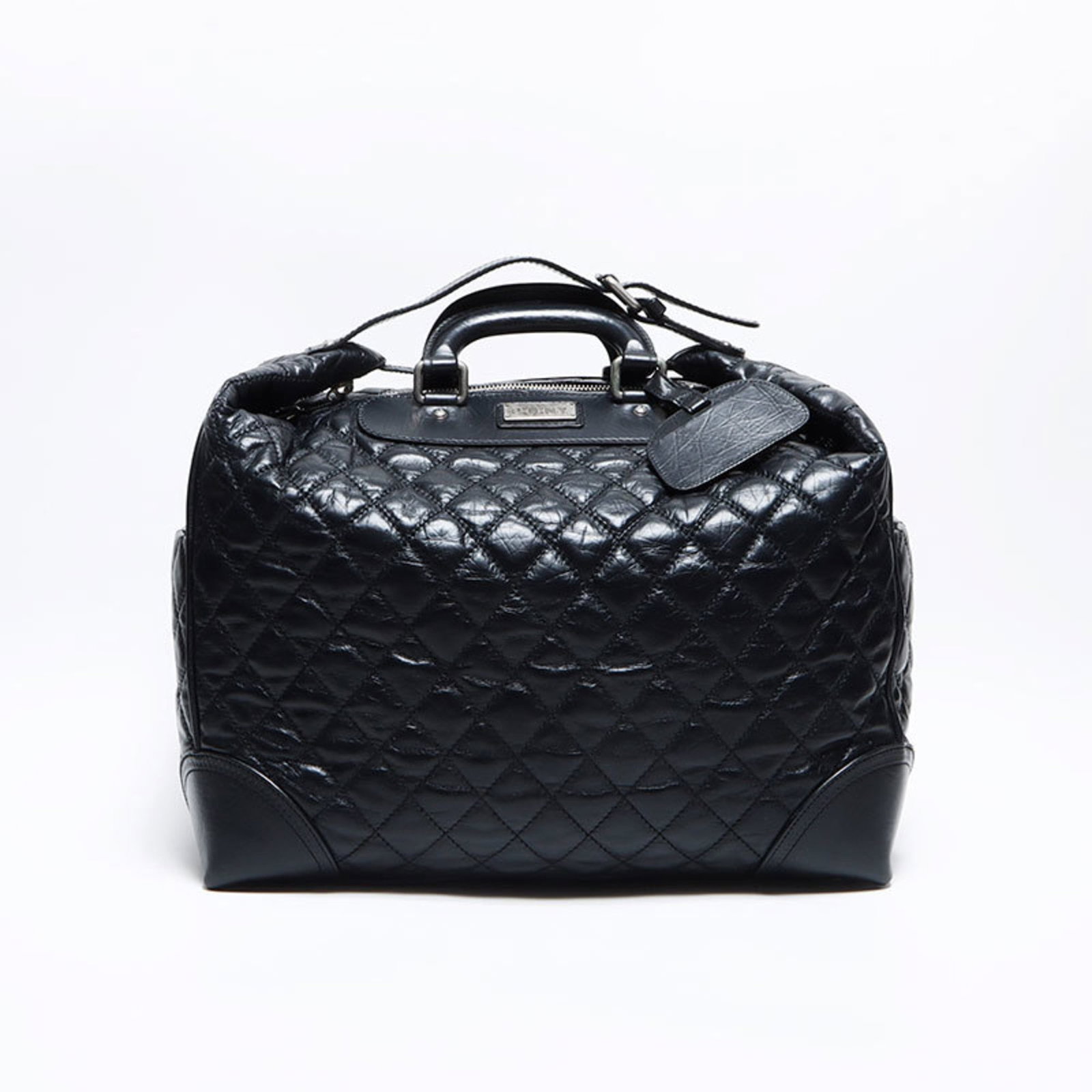 Boston Bag by Chanel: Boston Bag by Chanel Black Boston Bag by Chanel, featuring a classic design with clean lines and timeless elegance. This used bag has some traces of usage, including minor scratches and dirt, but