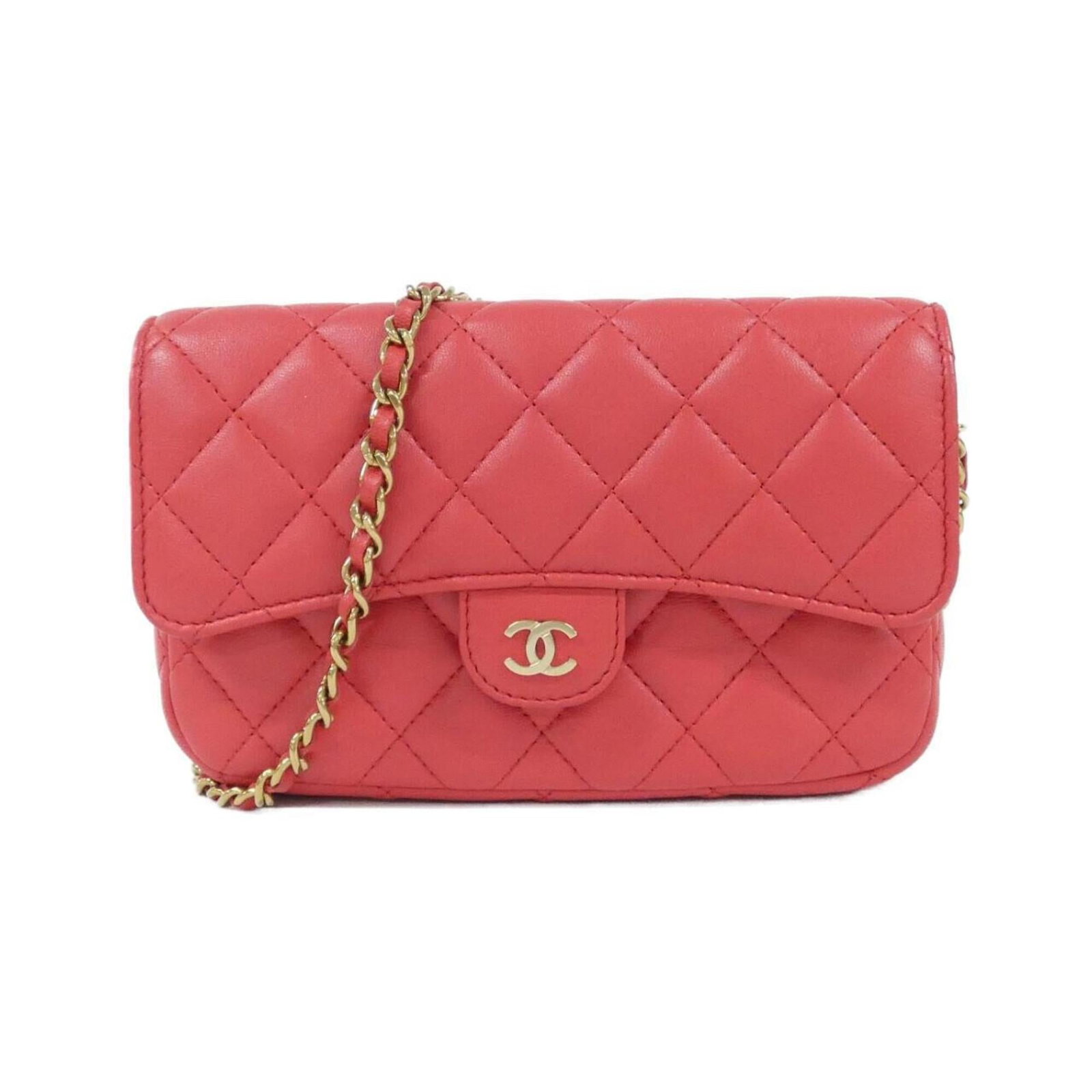Phone wallet leather by Chanel: Phone wallet leather by Chanel Chanel's iconic phone wallet is crafted from luxurious lambskin leather in a bold red hue. Measuring 10cm x 17cm x 4cm, it features a classic design with subtle