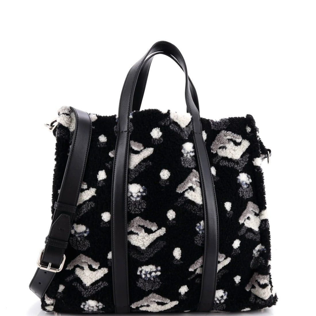 Fendi Convertible Shopping Tote Printed Shearling Large: Fendi Convertible Shopping Tote Printed Shearling Large Black Fendi Convertible Shopping Tote with Shearling Exterior, featuring pilling and creases. This large tote measures 14" x 16" x 6" and has a