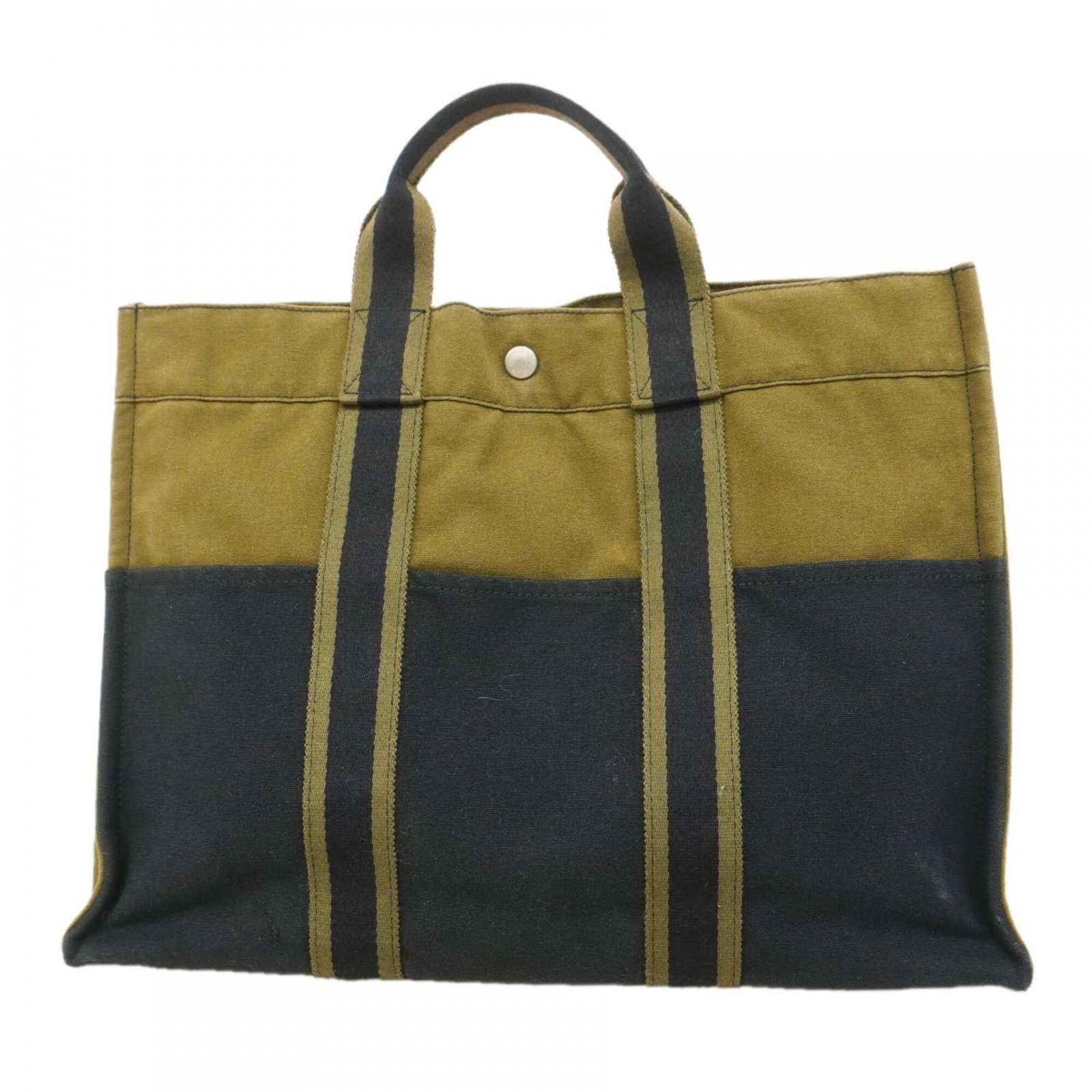 Canvas tote bag by Hermes: Canvas tote bag by Hermes Canvas tote bag by Hermes, featuring a timeless black and khaki design with silver hardware. This classic tote measures 31.5cm x 43cm x 10.5cm and showcases the brand's