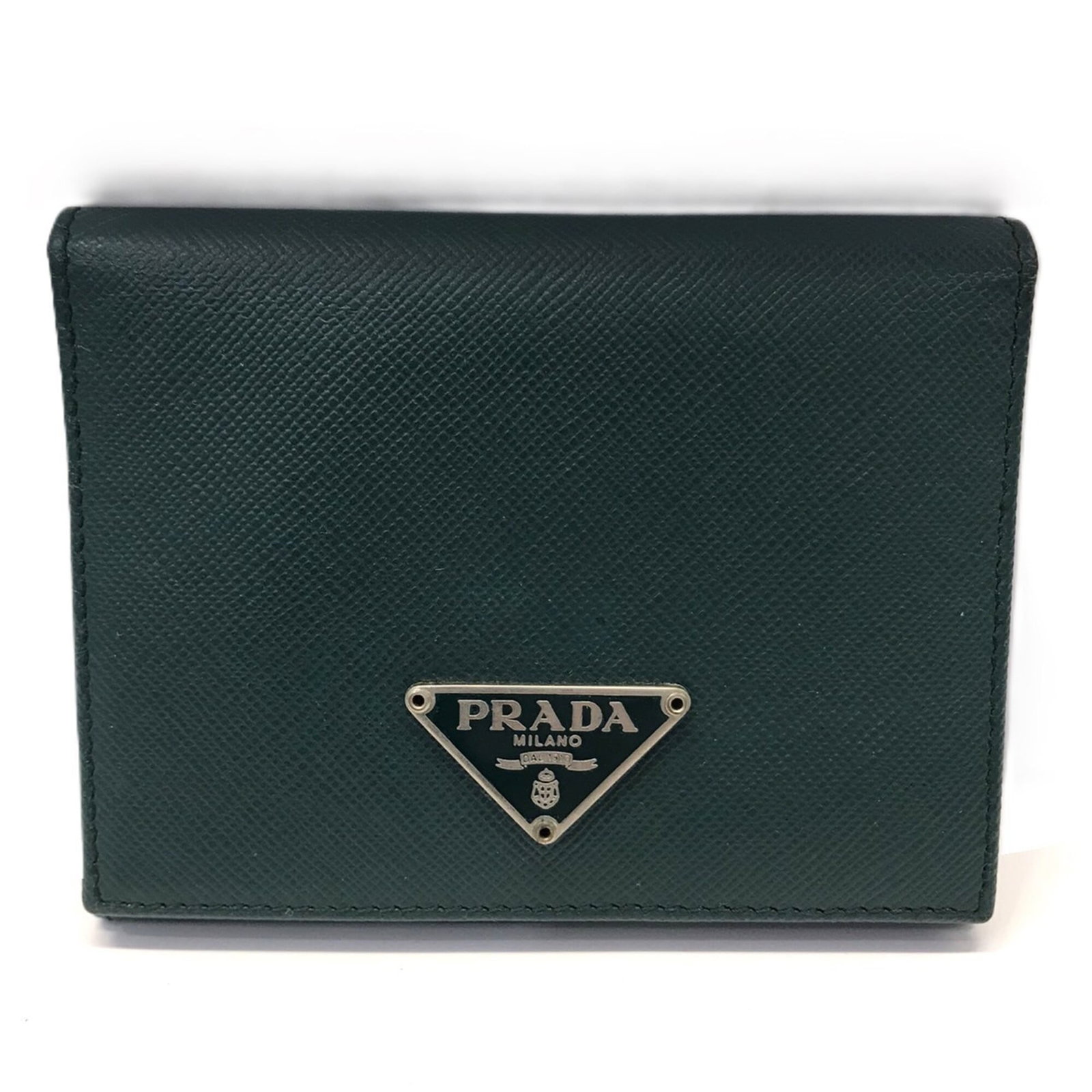 Triangle wallet with saffiano bi-fold: Triangle wallet with saffiano bi-fold Saffiano bi-fold wallet with a sleek triangle design in green. This Prada wallet has been used and shows signs of wear, including scratches and dirt, but remains