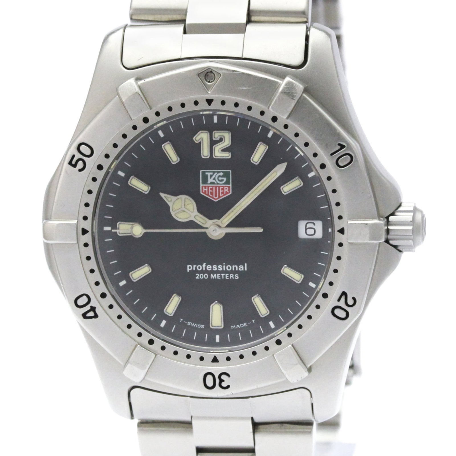 Wristwatch by Heuer: Wristwatch by Heuer Stainless steel case and band, the Heuer wristwatch boasts a sleek black dial. Measuring 38mm in diameter, this sporty timepiece is crafted from durable materials that have withsto