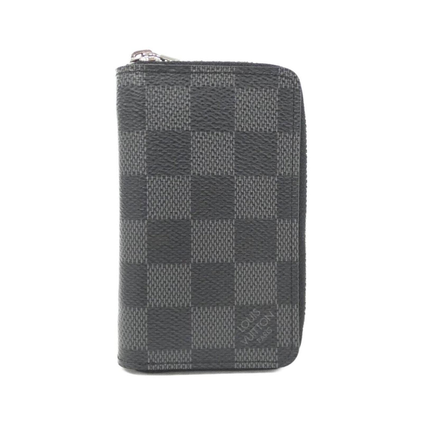Louis Vuitton coin purse coated canvas case: Louis Vuitton coin purse coated canvas case Coated canvas case from Louis Vuitton, featuring the iconic monogram pattern in graphite color. This coin purse measures 12cm x 7cm x 2cm and has a few