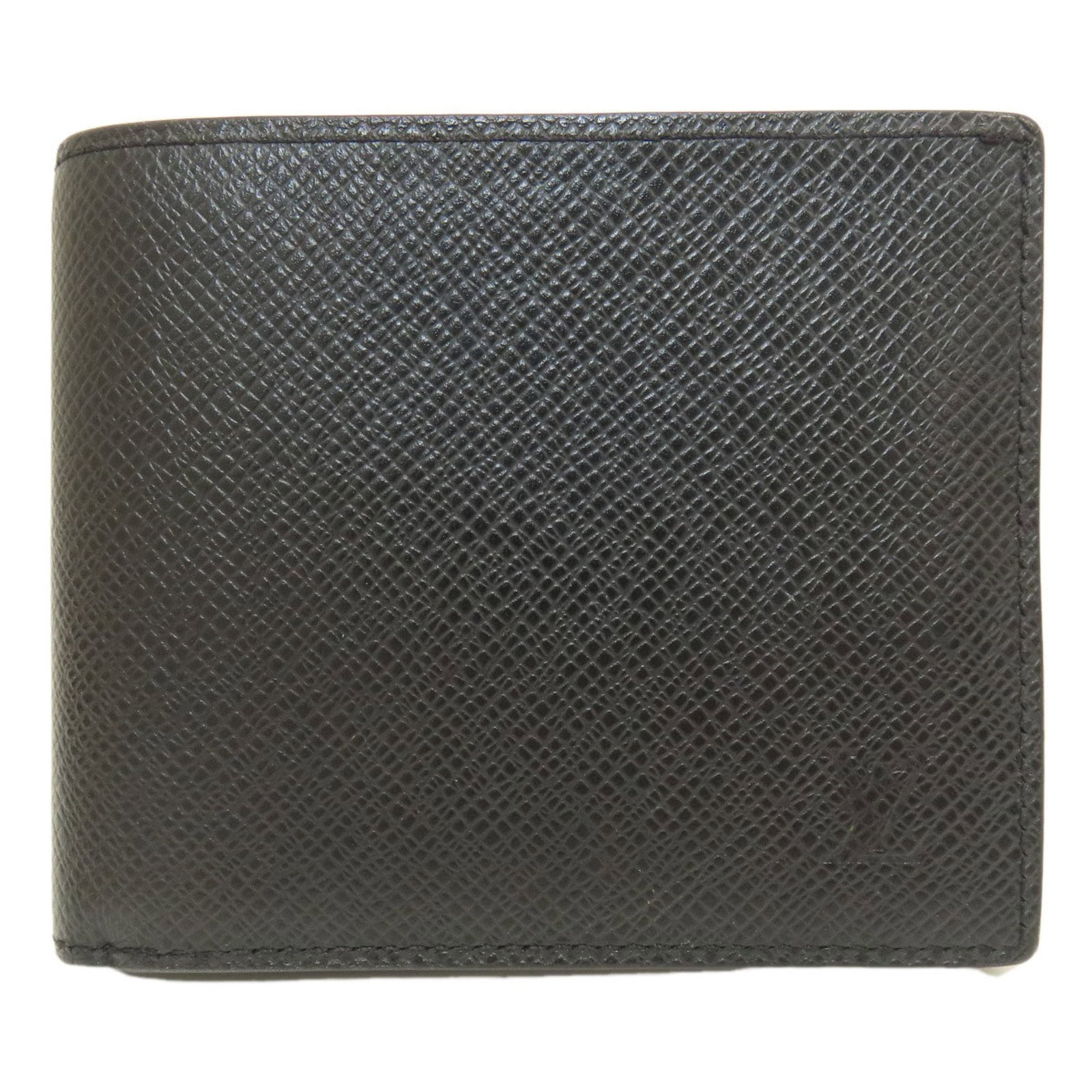 Louis Vuitton Wallet (Bi-Fold) Taiga Leather: Louis Vuitton Wallet (Bi-Fold) Taiga Leather Taiga Leather Black Bi-Fold Wallet from Louis Vuitton, featuring a classic design with a few traces of usage visible. The wallet has some scratches and dir