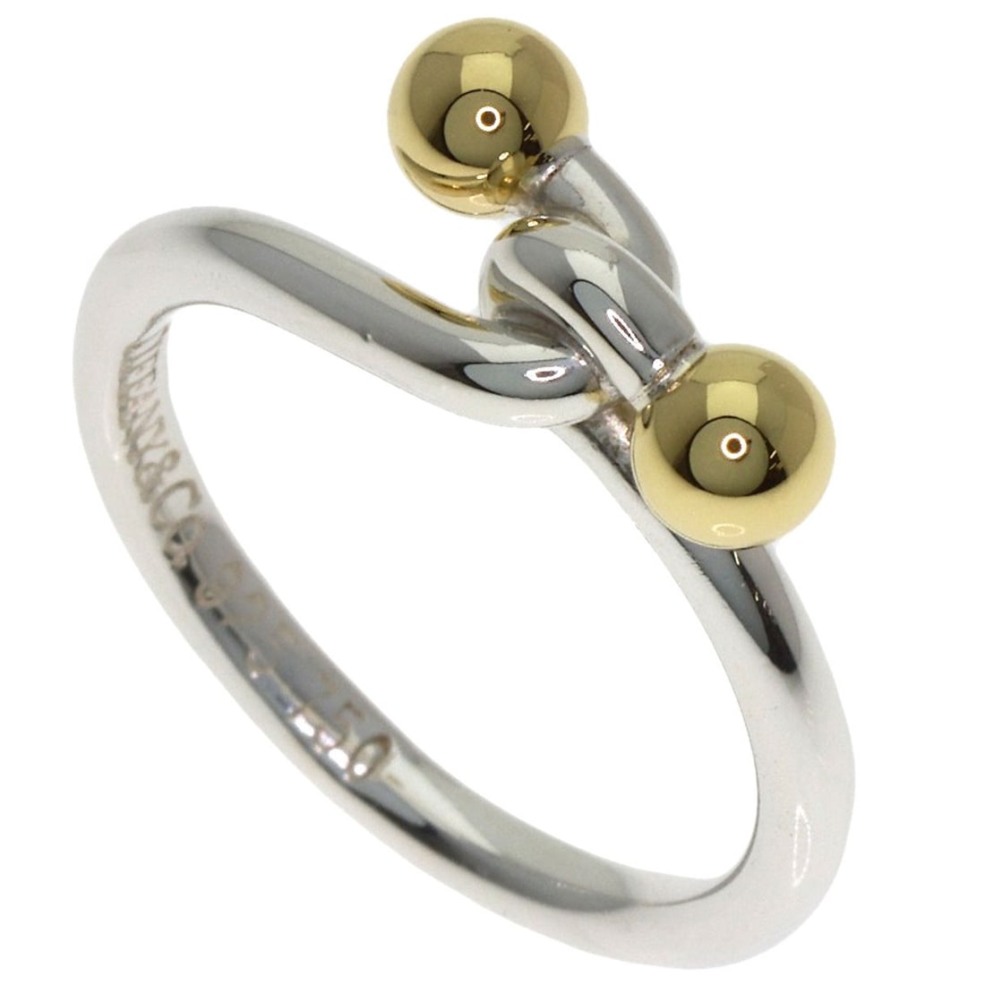 Love knot ring silver 18k yellow gold by Tiffany & Co: Love knot ring silver 18k yellow gold by Tiffany & Co Silver Love Knot Ring by Tiffany & Co in 18k Yellow Gold. This elegant ring features a classic love knot design, crafted from sterling silver and 